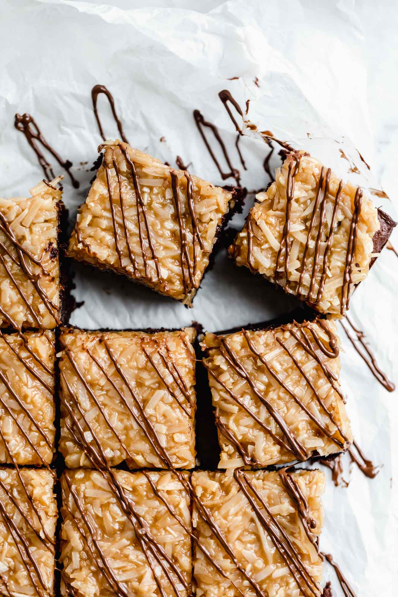 These Samoa brownies are fudgy brownies topped with homemade coconut caramel sauce and drizzled with chocolate. Perfect for any Girl Scout cookie lover!