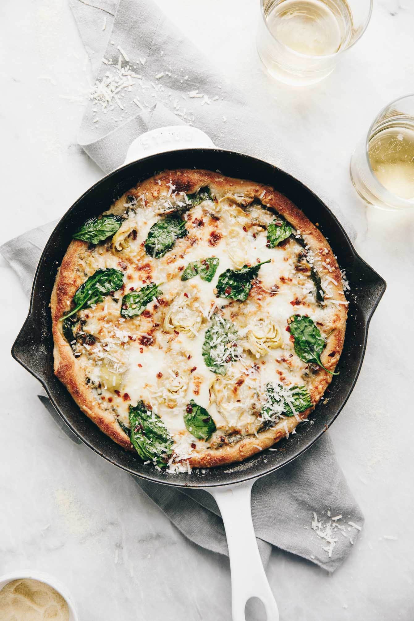 Easy cheesy spinach artichoke pizza so delicious, you'll eat the whole pie yourself