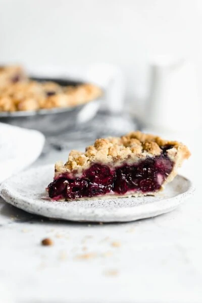 slice of cherry pie with crumb topping