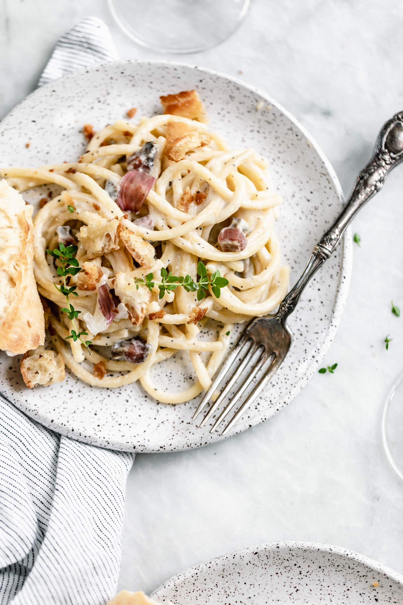 A creamy Roman classic made with bucatini, guanciale, parmigiano, and egg yolks, this Date Night Pasta Carbonara is perfectly portioned for two!