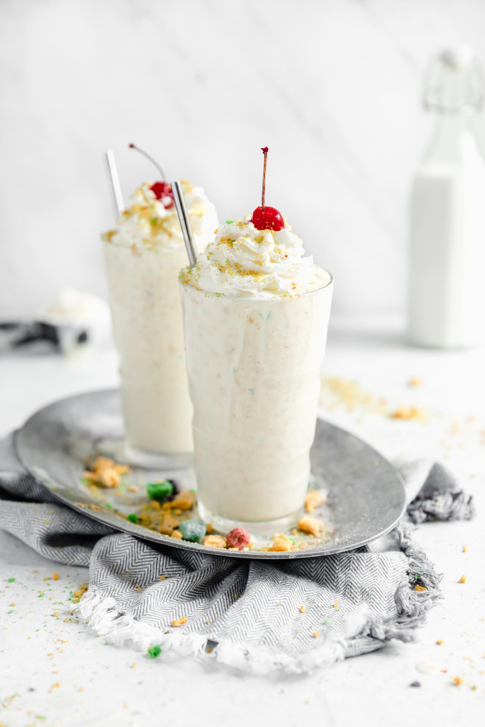captain crunch milkshake with whipped cream and cherry on top