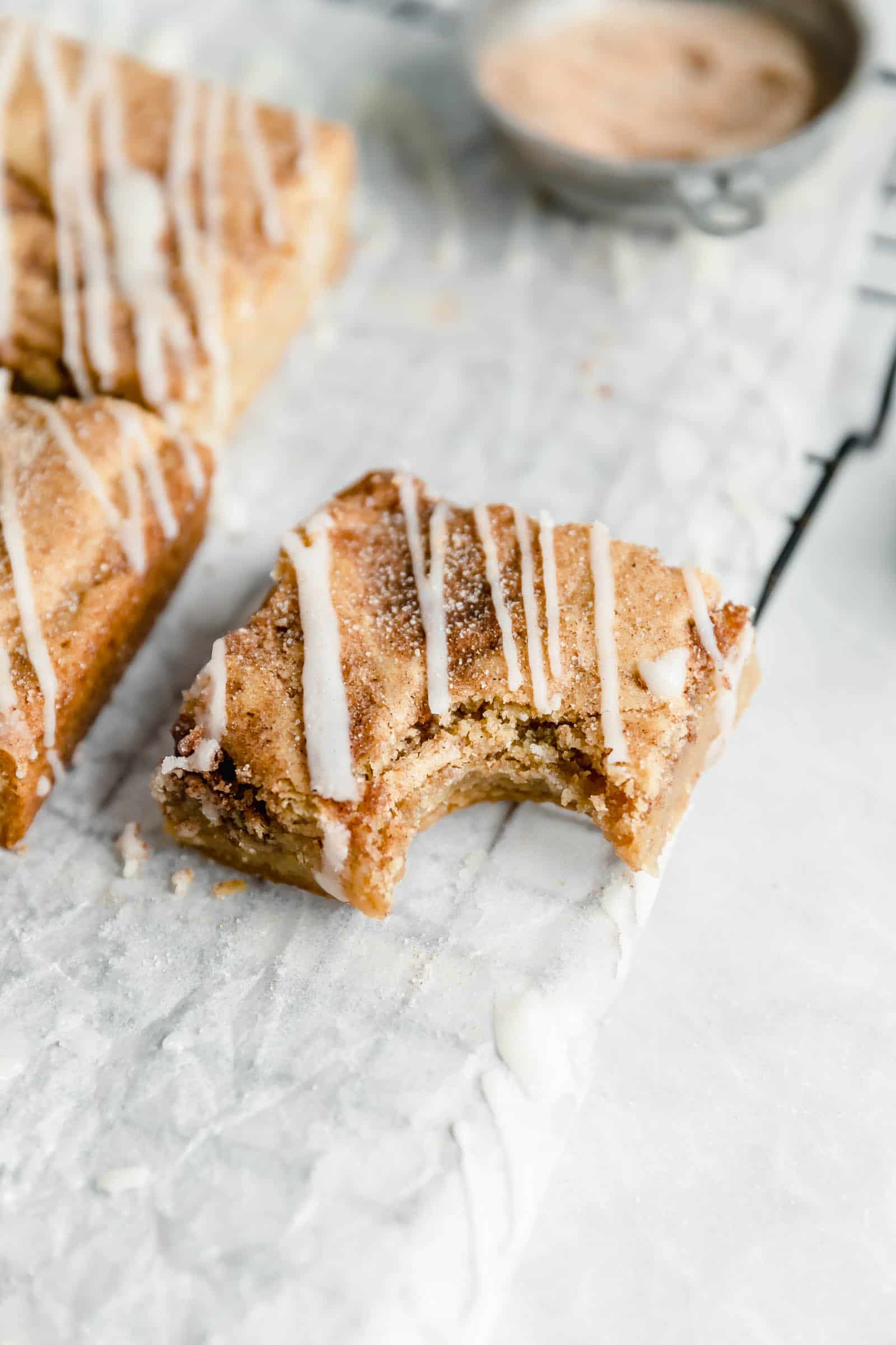 cinnamon roll blondie with a bite taken out of it