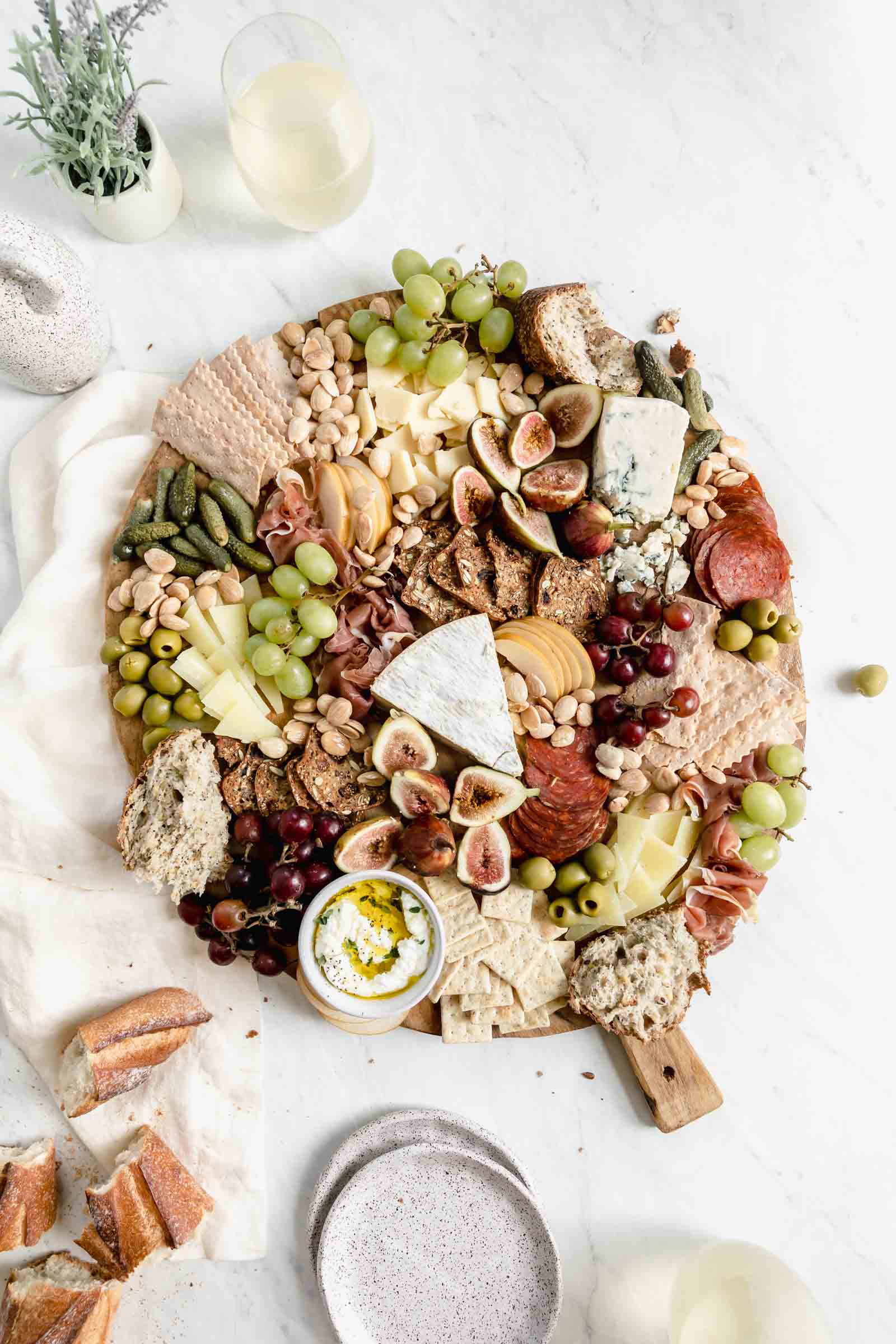 fill in cheese board gaps with marcona almonds to complete cheeseboard