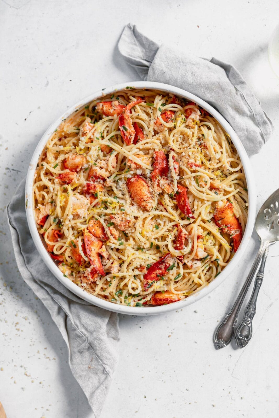 lobster pasta in a large bowl loaded with fresh lobster in a luscious butter sauce