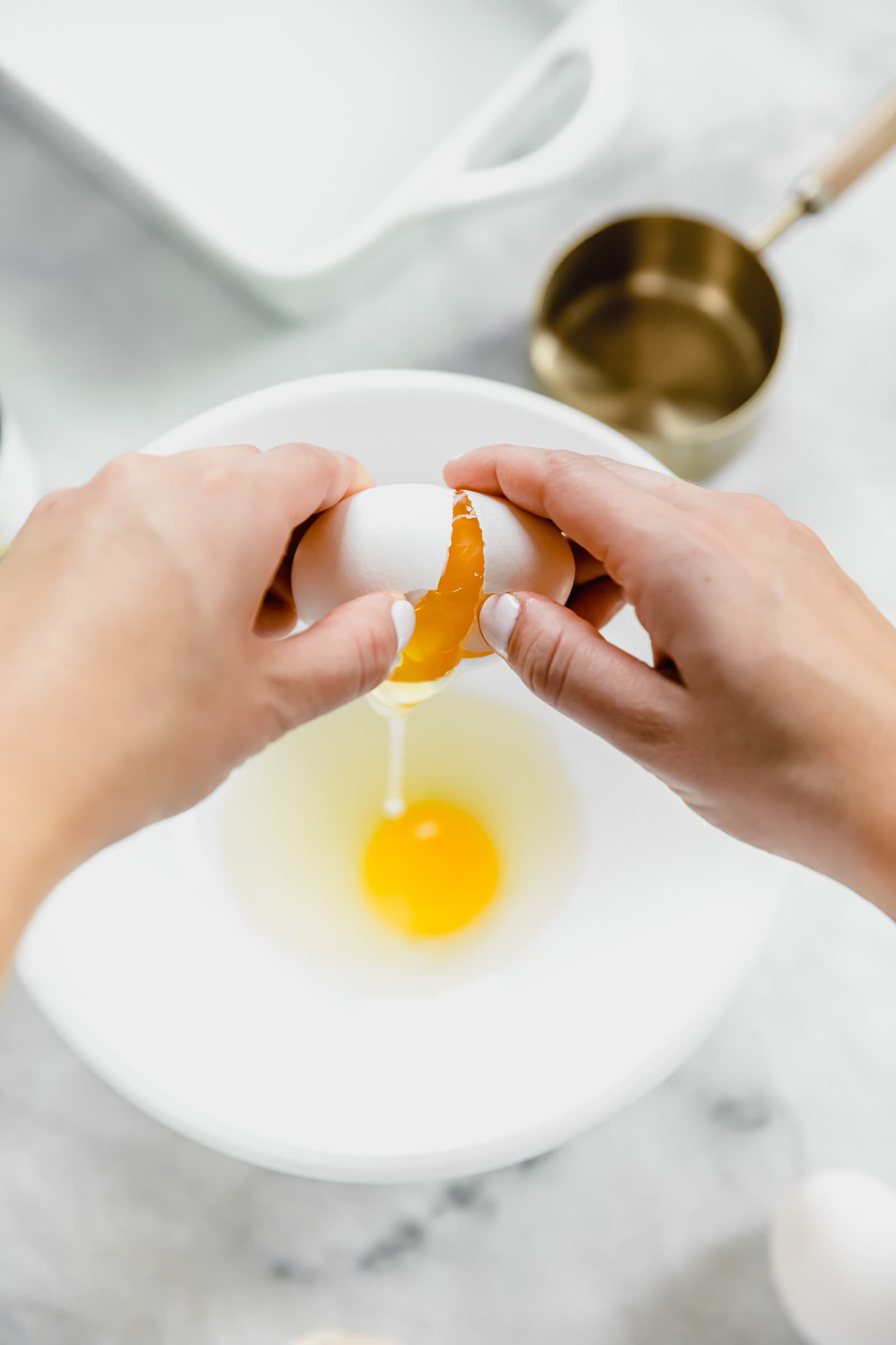 egg being cracked into bowl