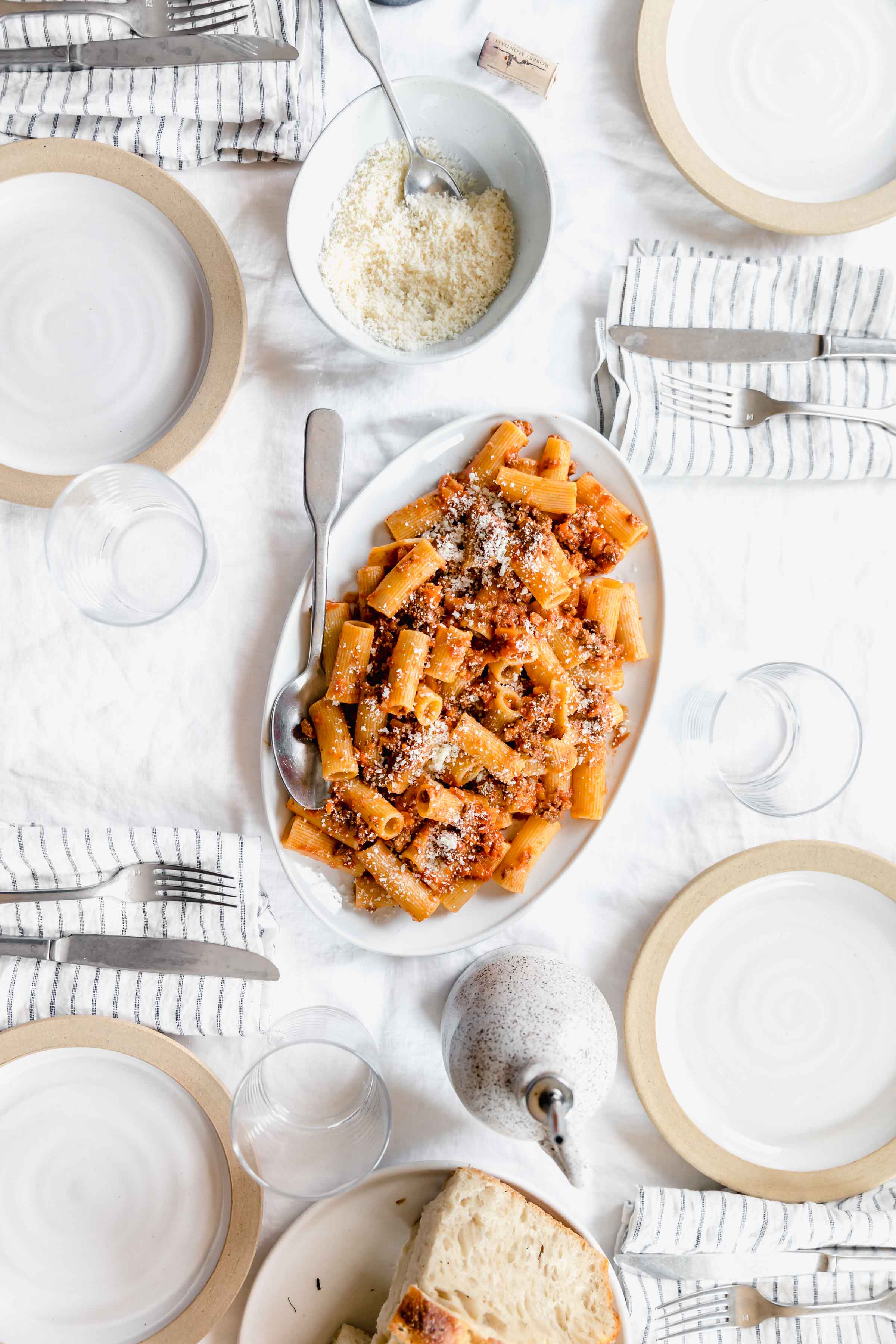 plate of rigatoni bolognese on a dinner scape