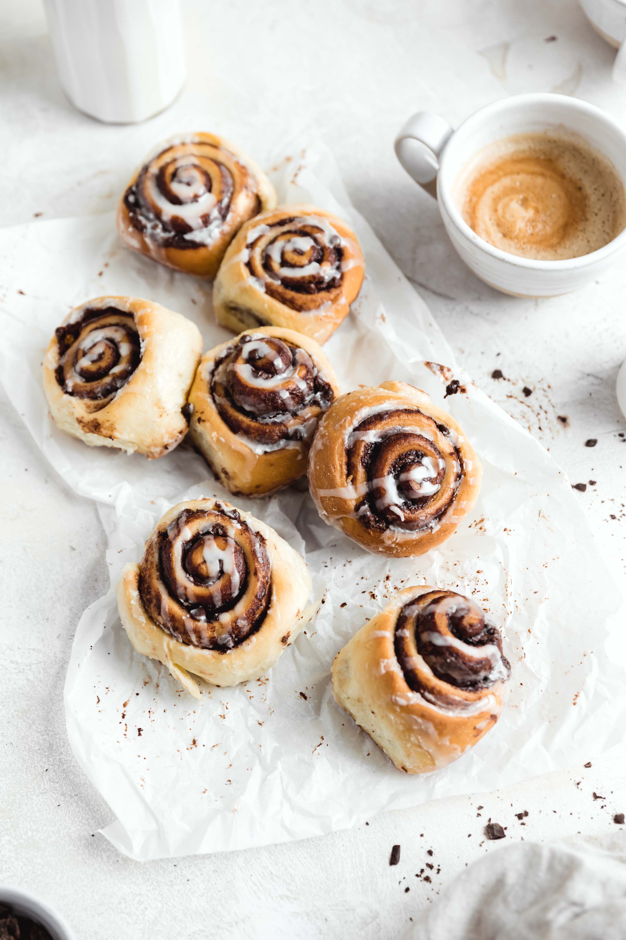 Nothing says holiday baking more than cinnamon rolls...except maybe CHOCOLATE cinnamon rolls. These pillow soft cinnamon rolls are filled with chocolate, drizzled wit the most perfect cream cheese icing and absolutely scrumptious. Best part? They’re ready in under an hour. #cinnamonrolls #bromabakery #foodphotography #easy