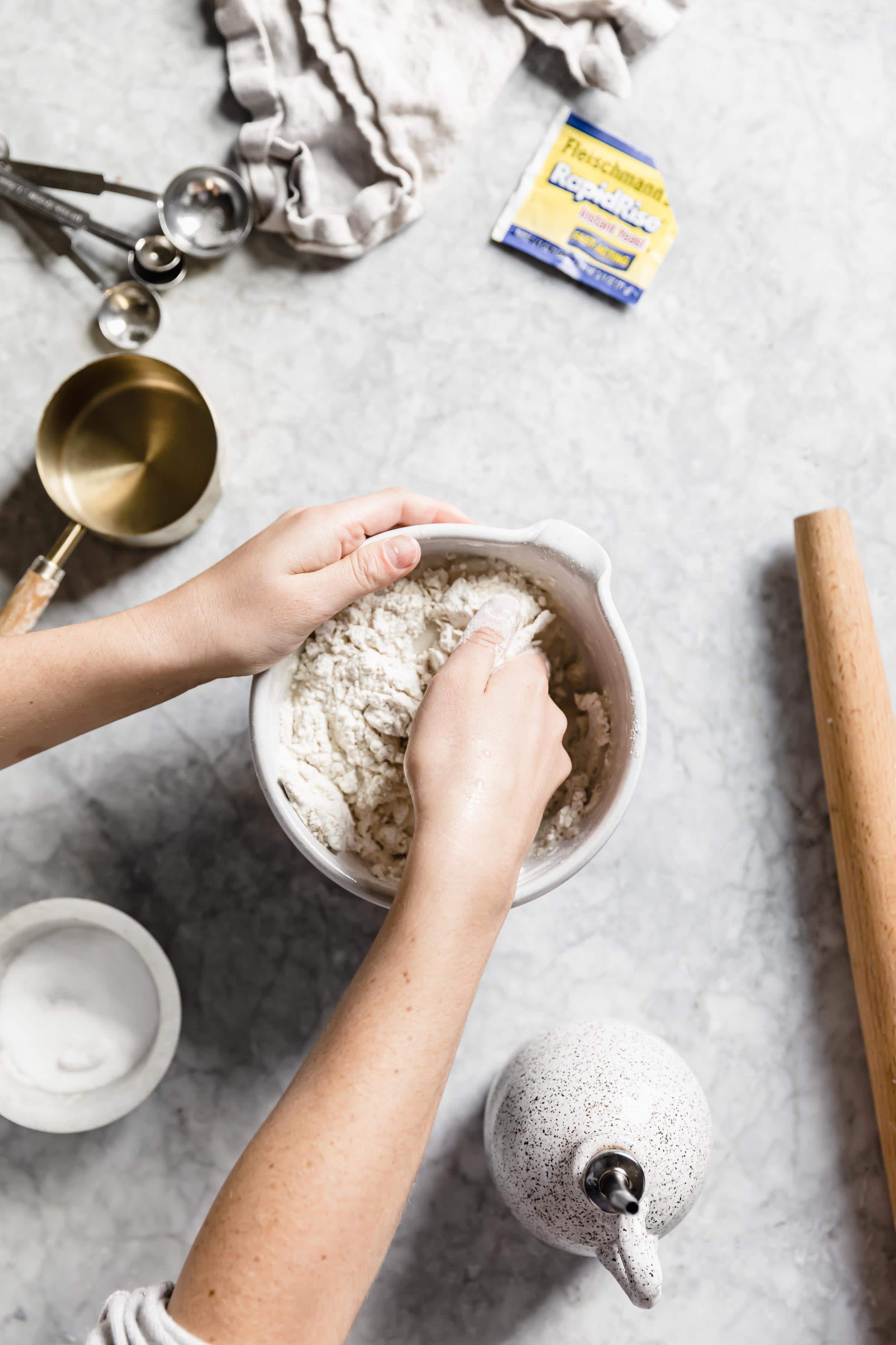 how to make homemade pizza dough mix together with hands