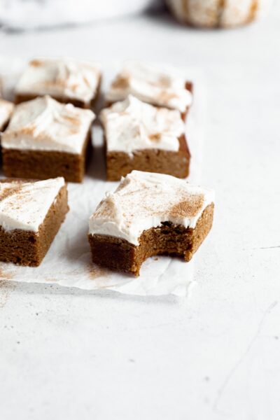 Gingerbread blondies in three rows with one piece slightly out
