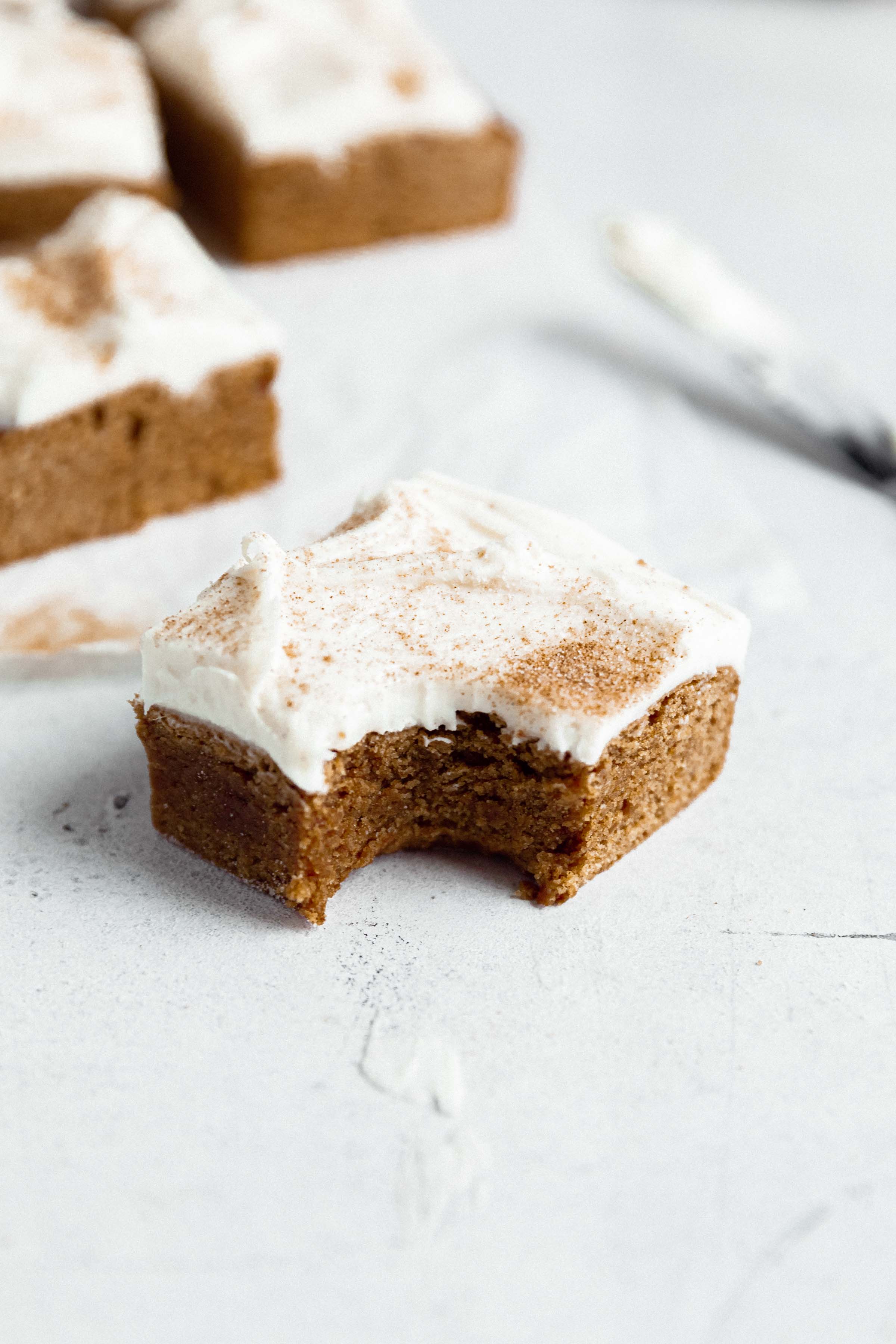 chewy gingerbread blondies with a bite taken out