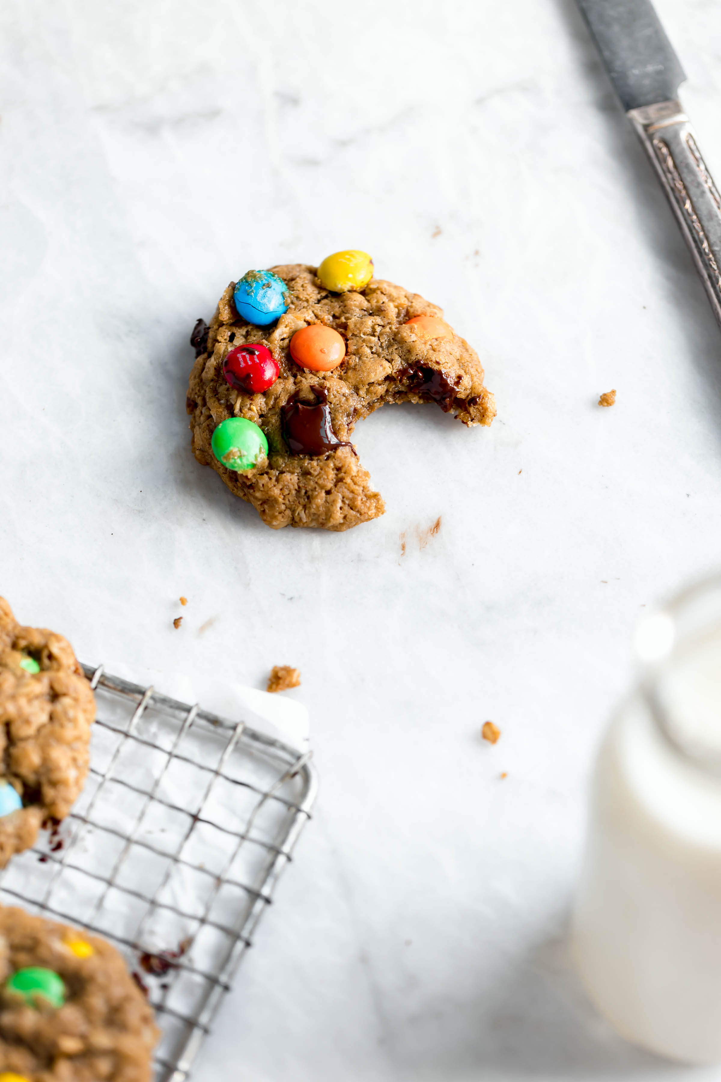 Healthier monster cookies made with peanut butter, coconut oil, maple syrup and old fashioned oats. And of course chocolate and m and ms.