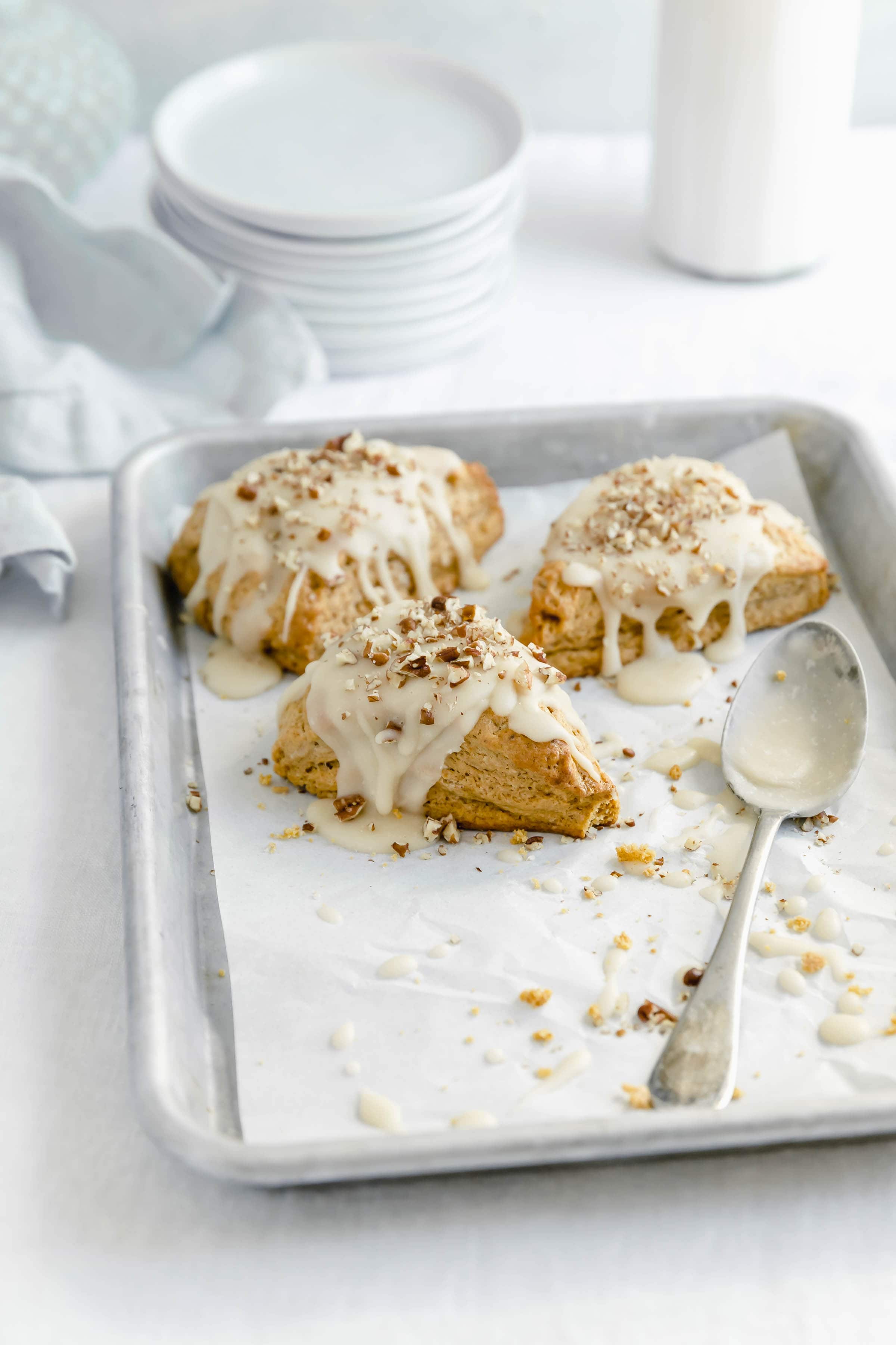 These moist af pumpkon scones with a to die for maple glaze are our new favorite fall treat!