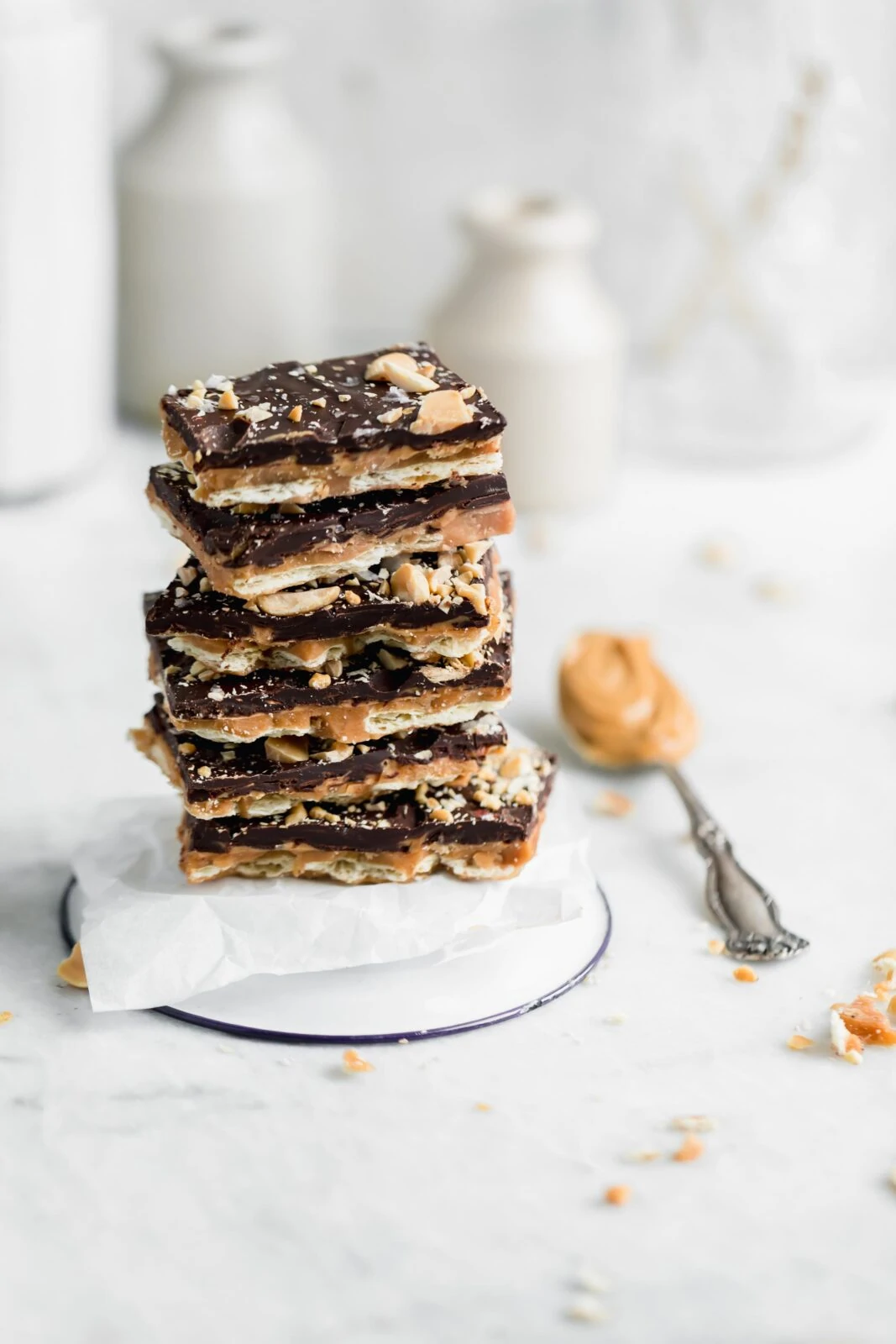 Stack of peanut butter saltine toffee bark. A crowd-pleasing sweet, salty, crunchy, and smooth Peanut Butter Toffee bark made entirely with ingredients you probably already have in your pantry! Hello, sweet thing!