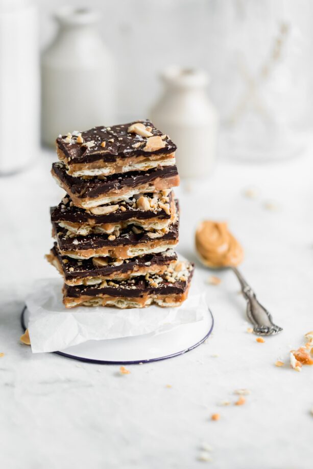 Stack of peanut butter saltine toffee bark. A crowd-pleasing sweet, salty, crunchy, and smooth Peanut Butter Toffee bark made entirely with ingredients you probably already have in your pantry! Hello, sweet thing!