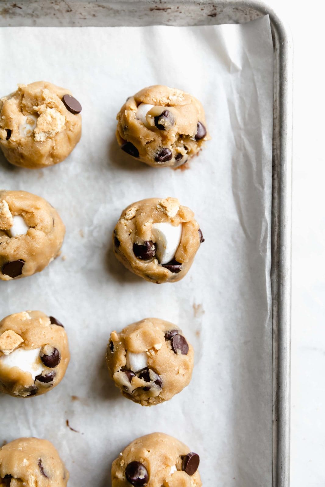 overhead shot of s'mores cookies cookie dough on parchment paper