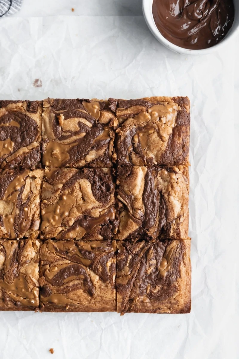 peanut butter and nutella swirled blondies cut into squares