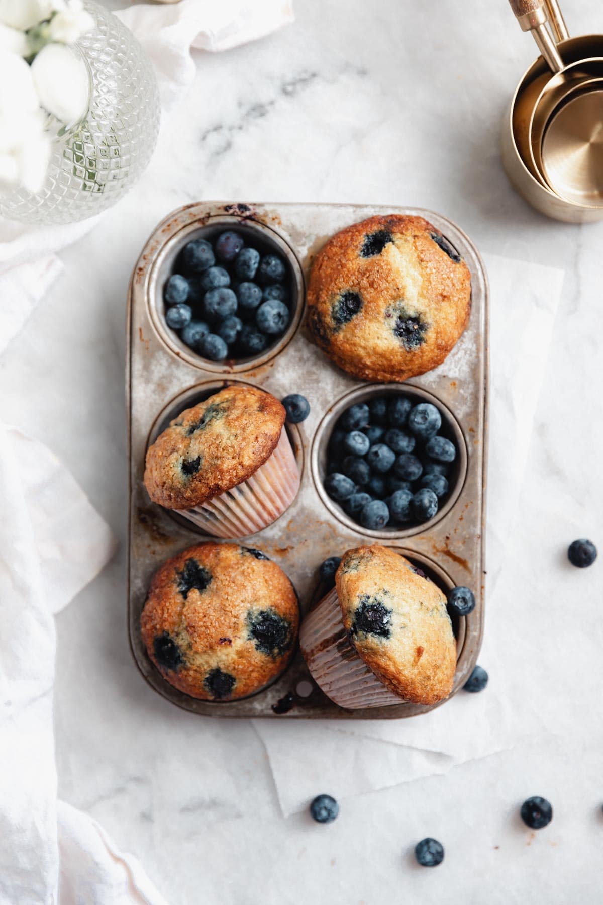 blueberry muffins in a muffin tin