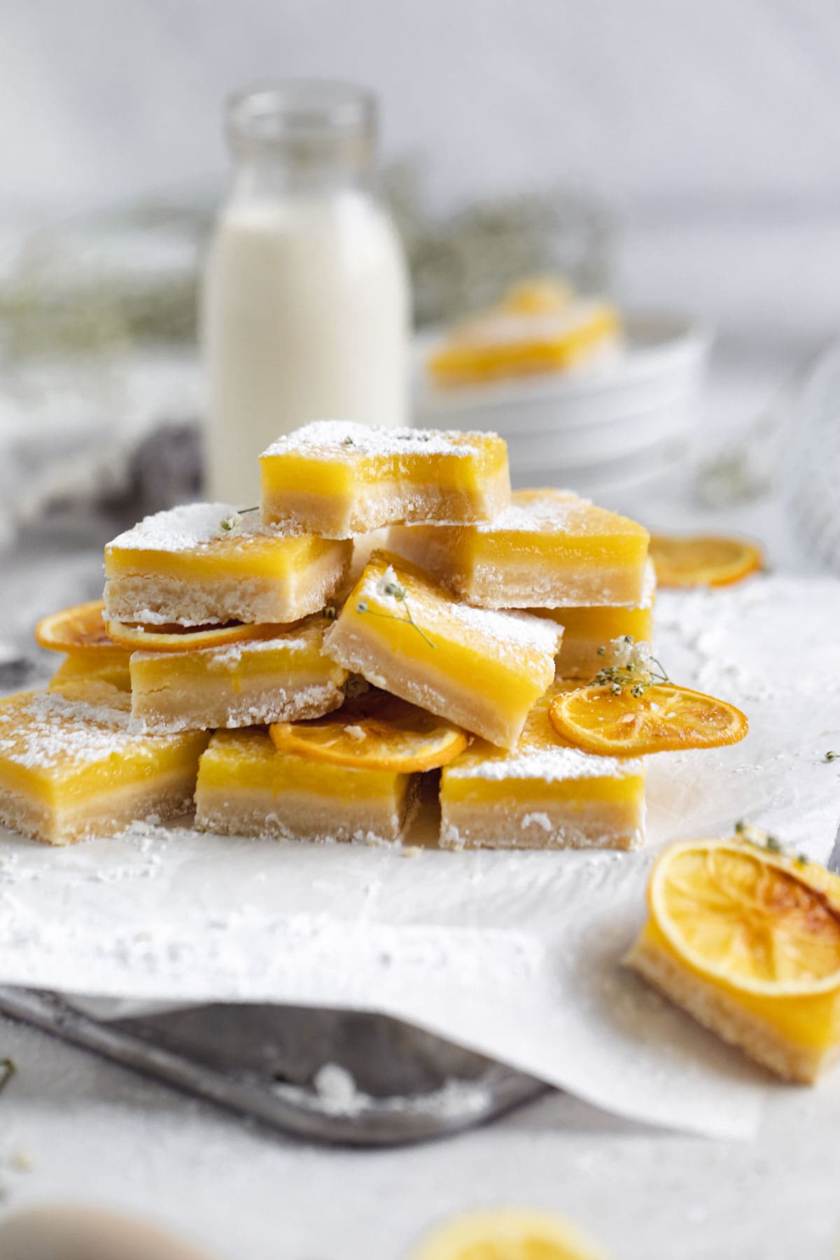stack of lemon bars dusted with sugar