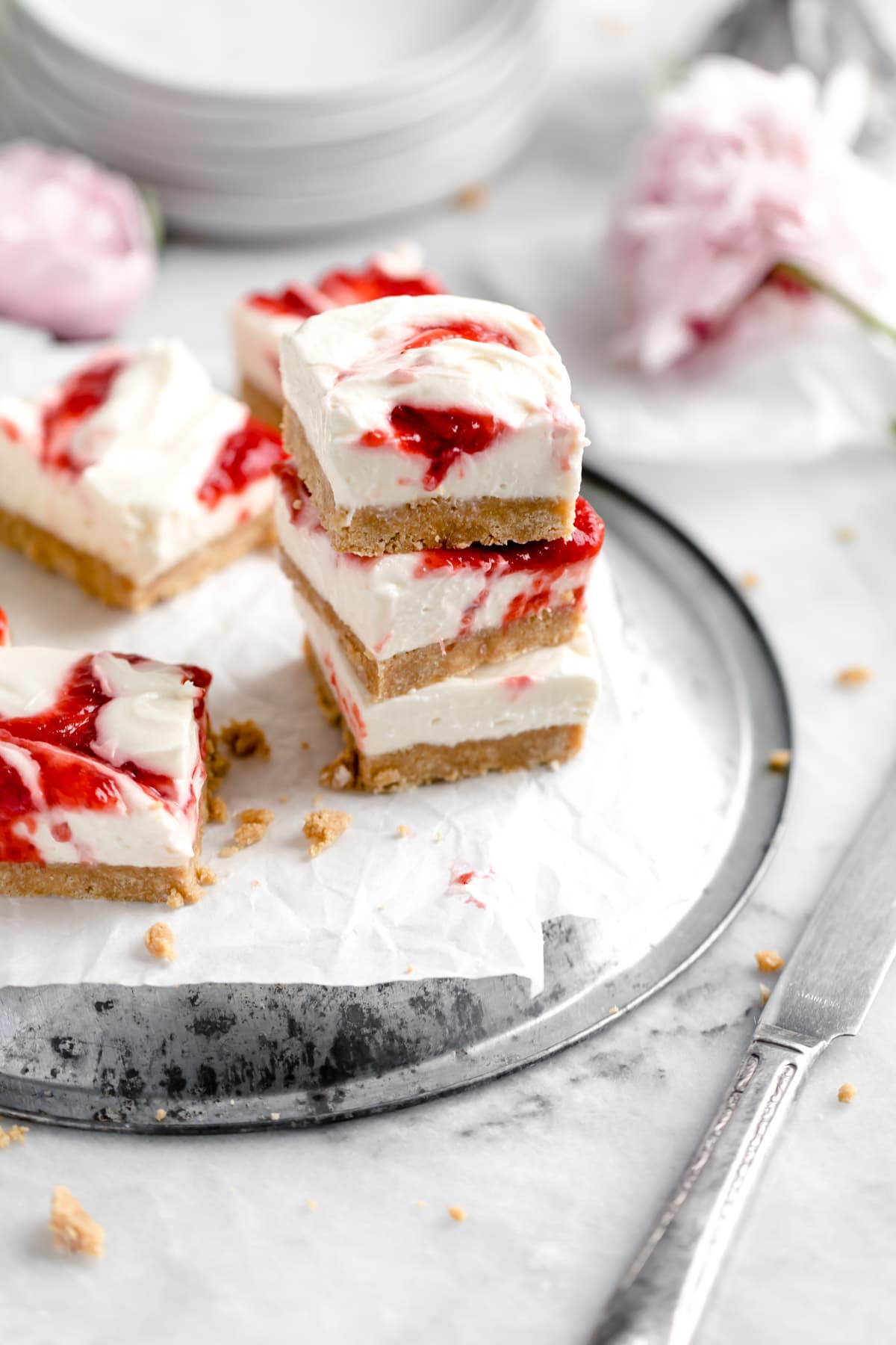 strawberry cheesecake bars in a stack