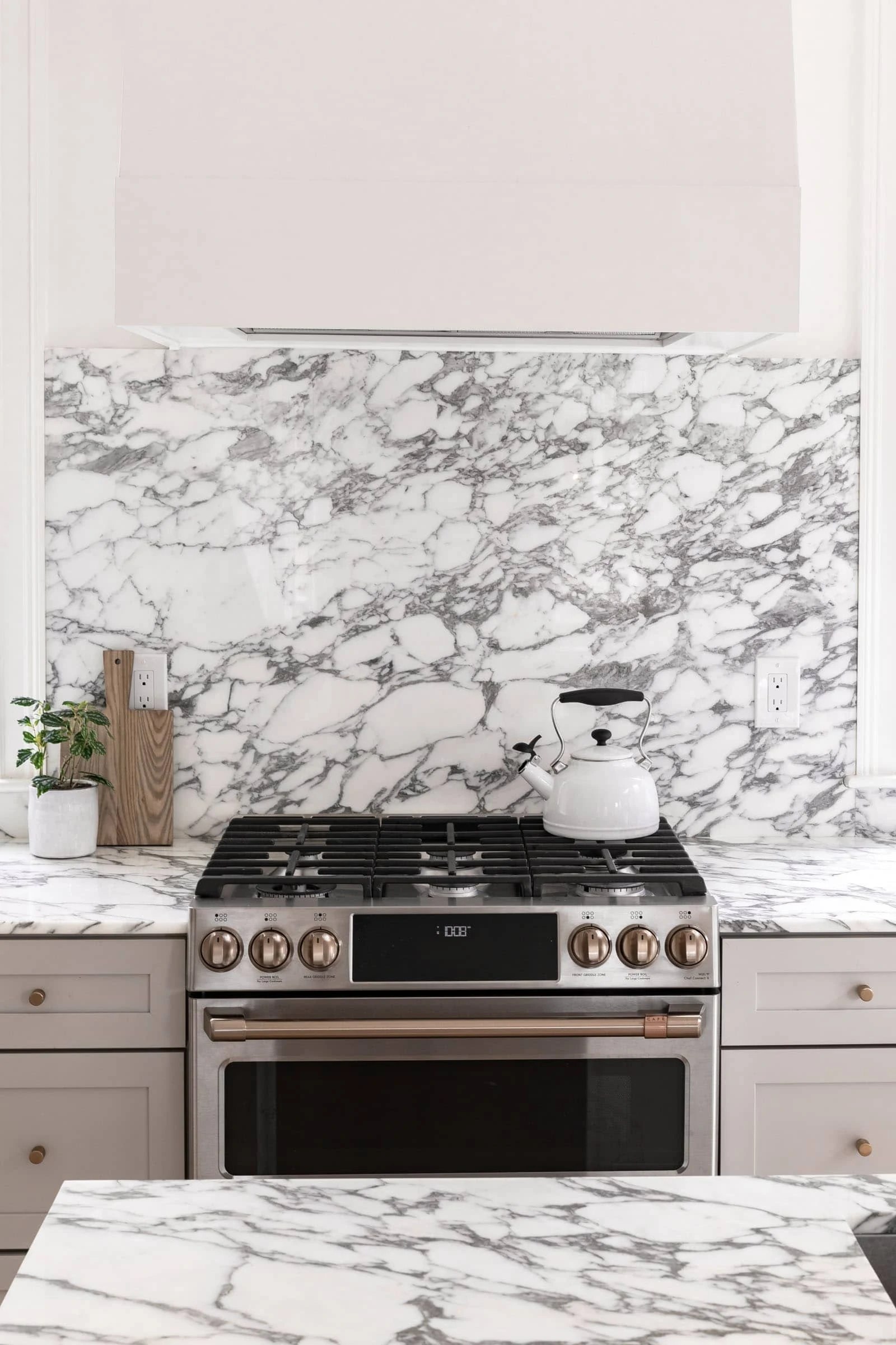 sleek cafe appliance stove in a marble kitchen