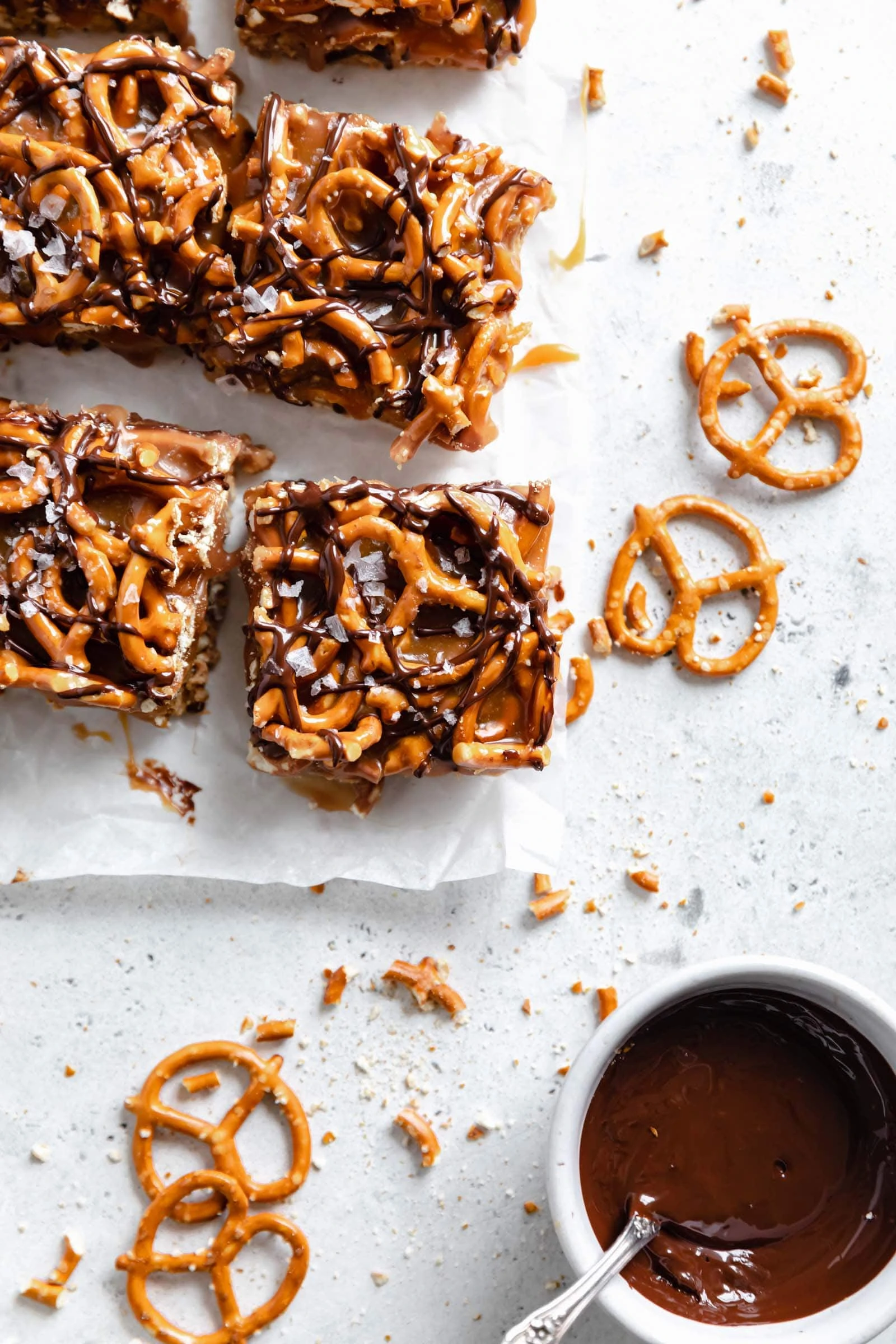 caramel peanut butter pretzel bars cut into squares