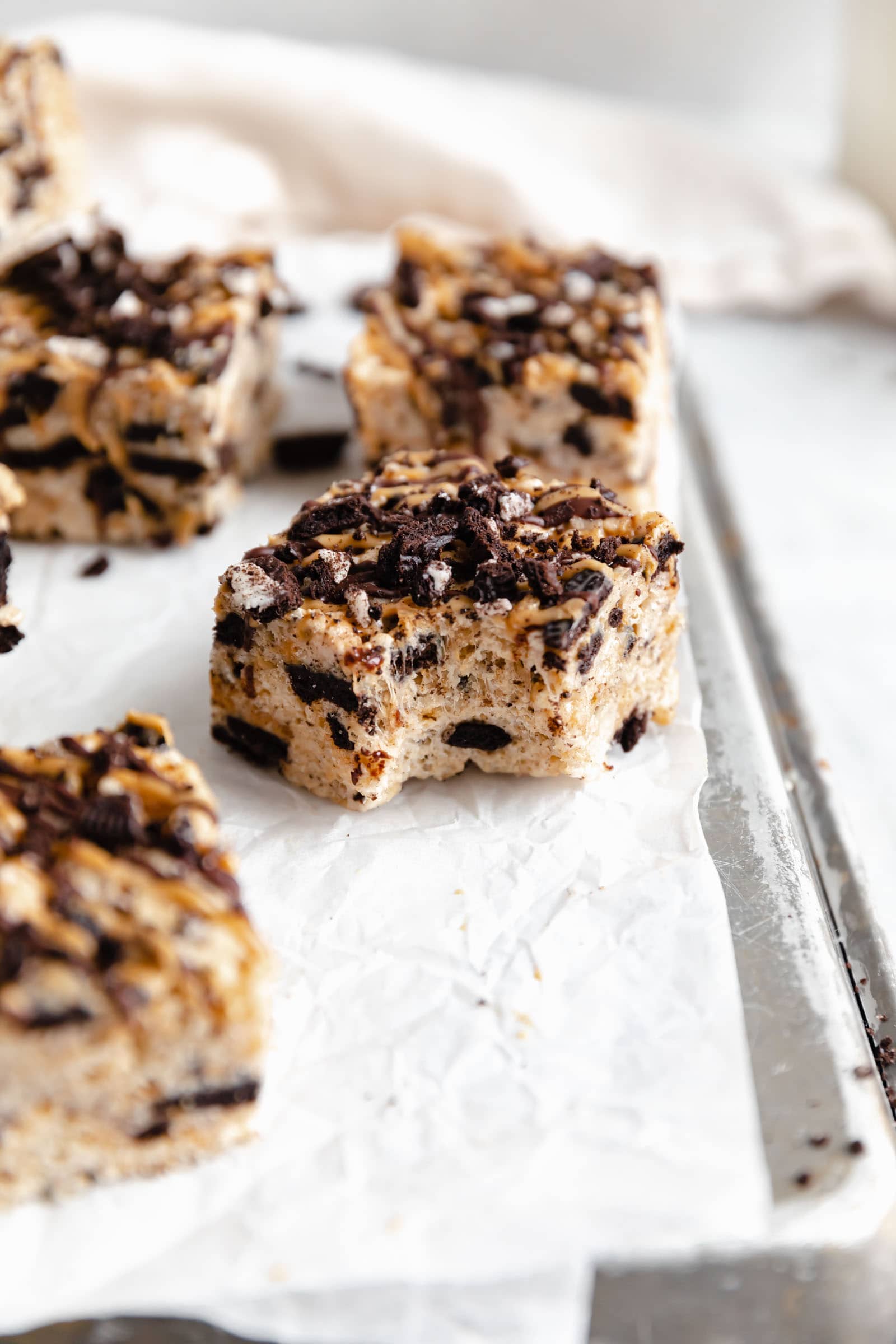 peanut butter oreo rice krispie treats with a bite taken out