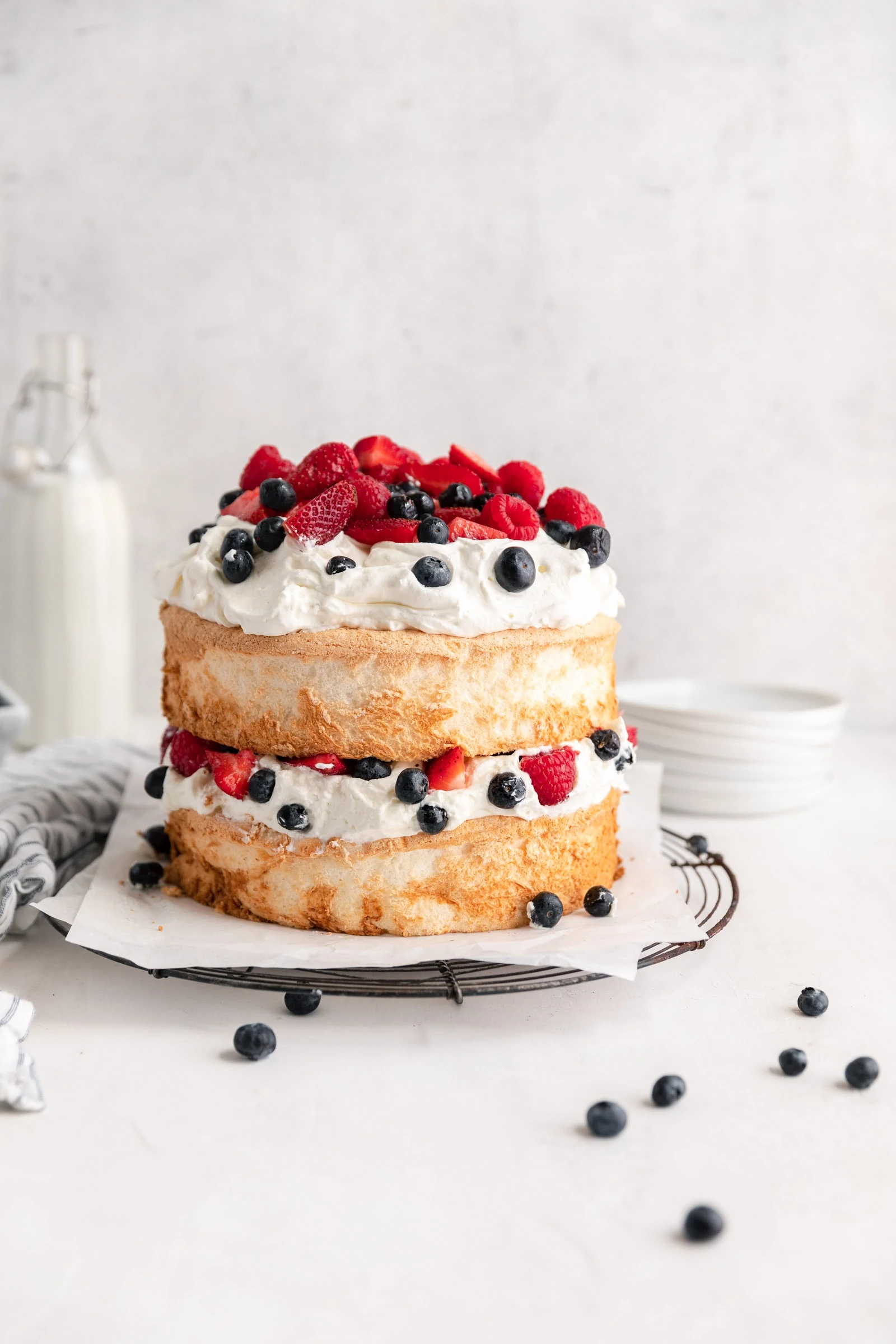 angel food cake with whipped cream and berries