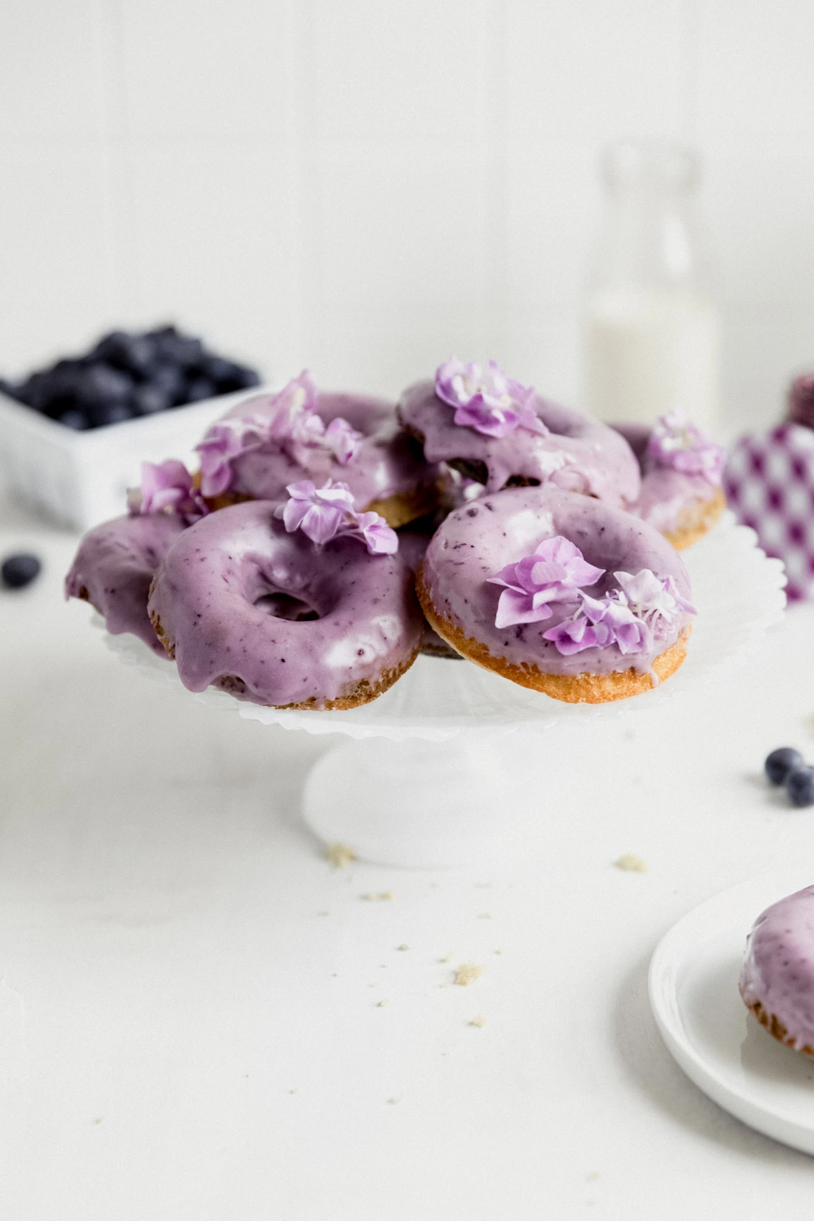 healthy blueberry donuts on a cake stand
