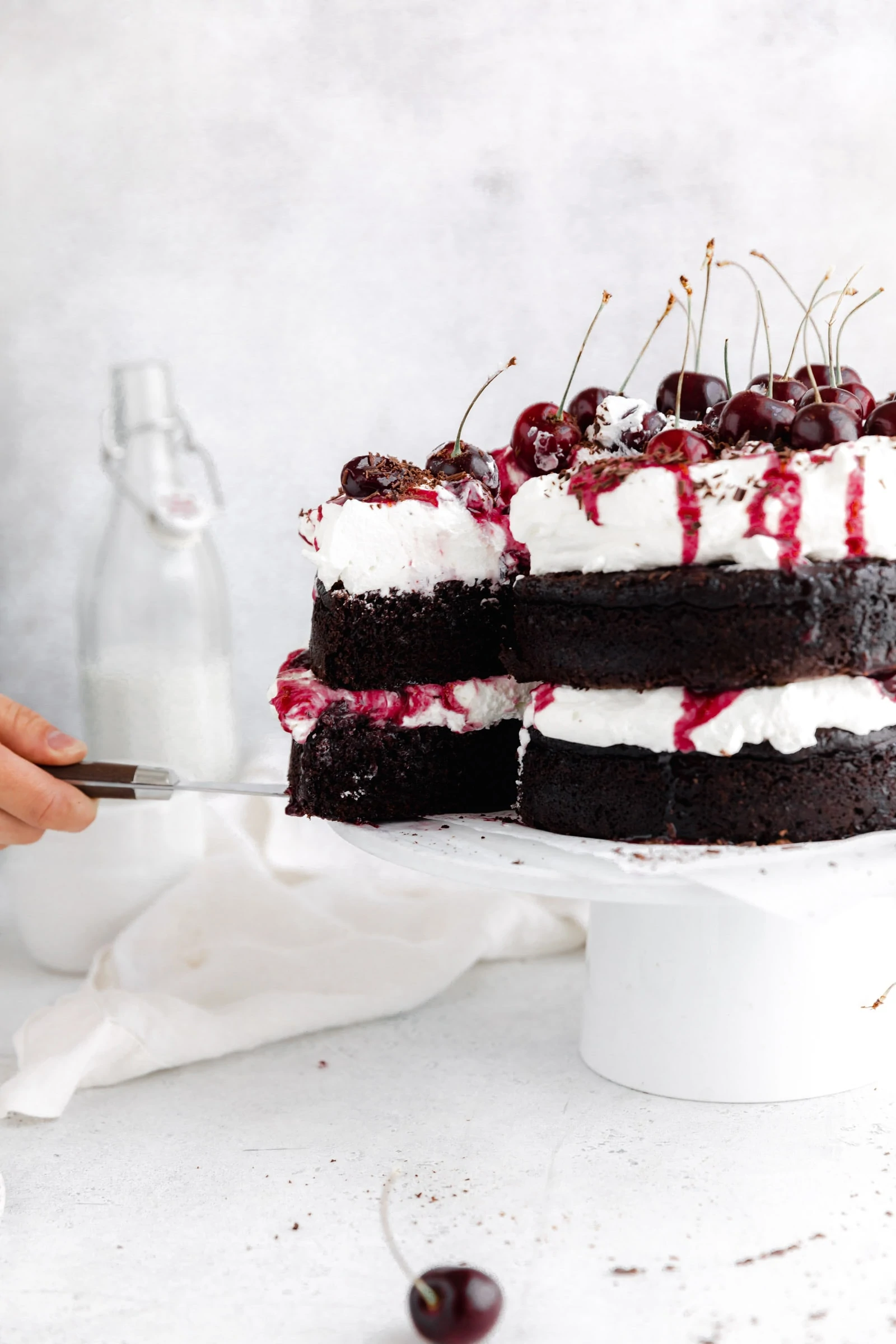 black forest cake with cherries and whipped cream