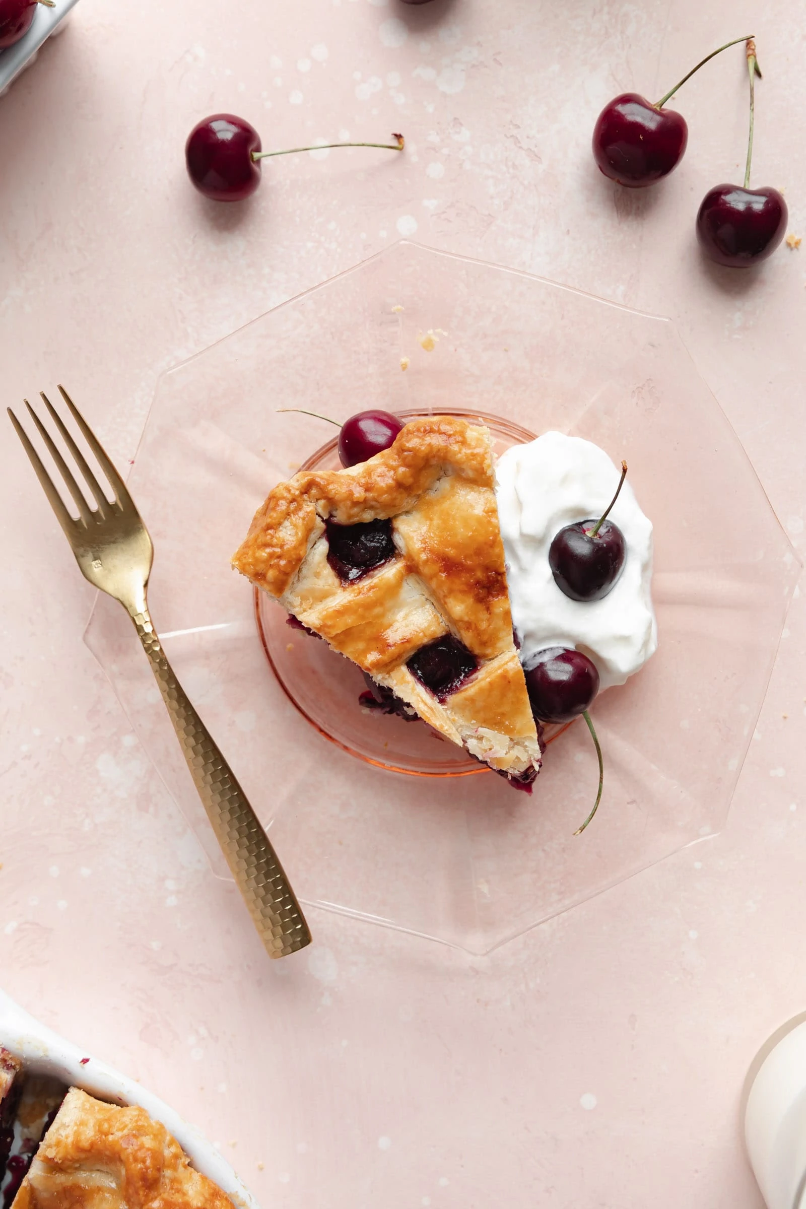 slice of cherry pie with whipped cream