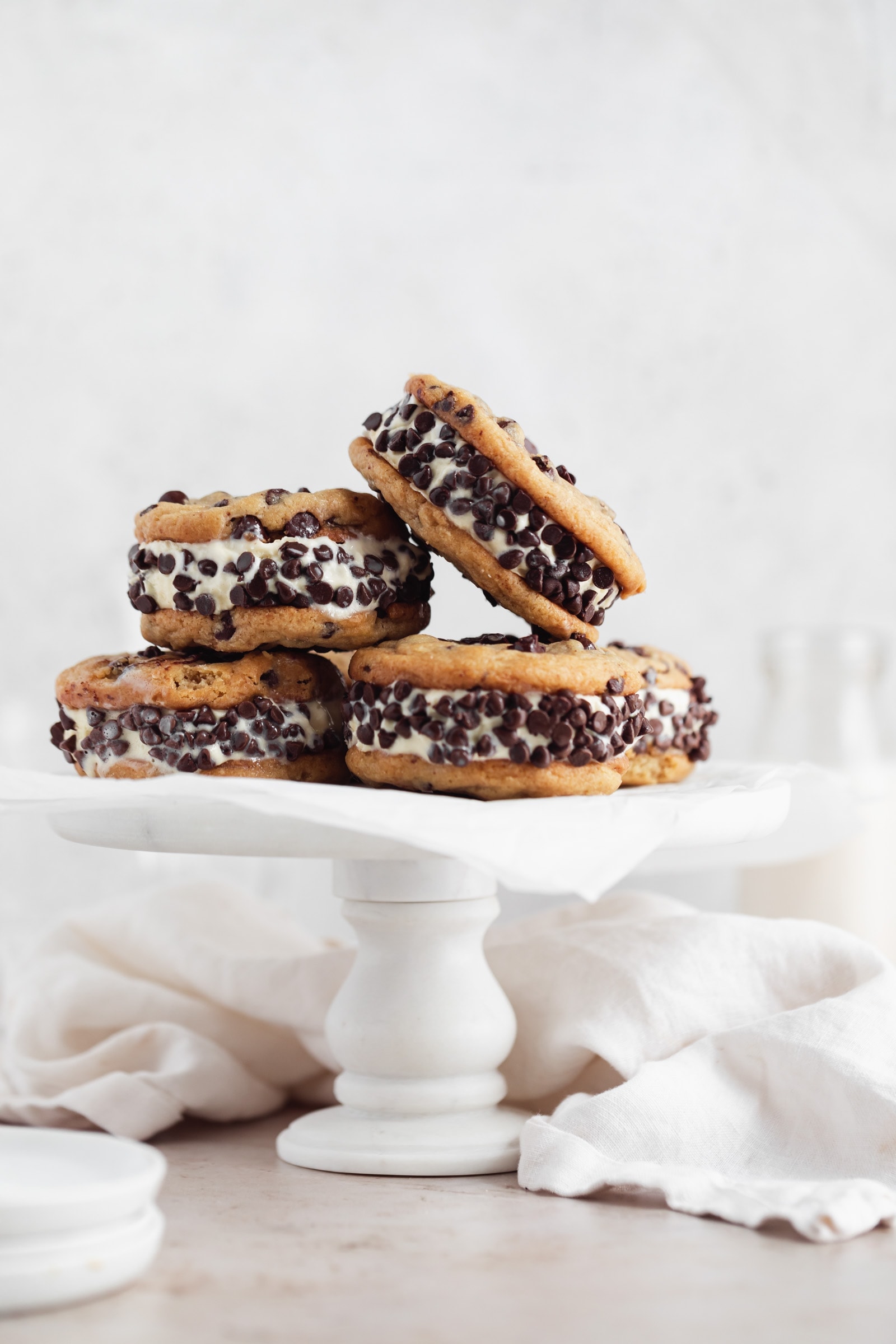 ice cream cookie sandwiches on a cake stand