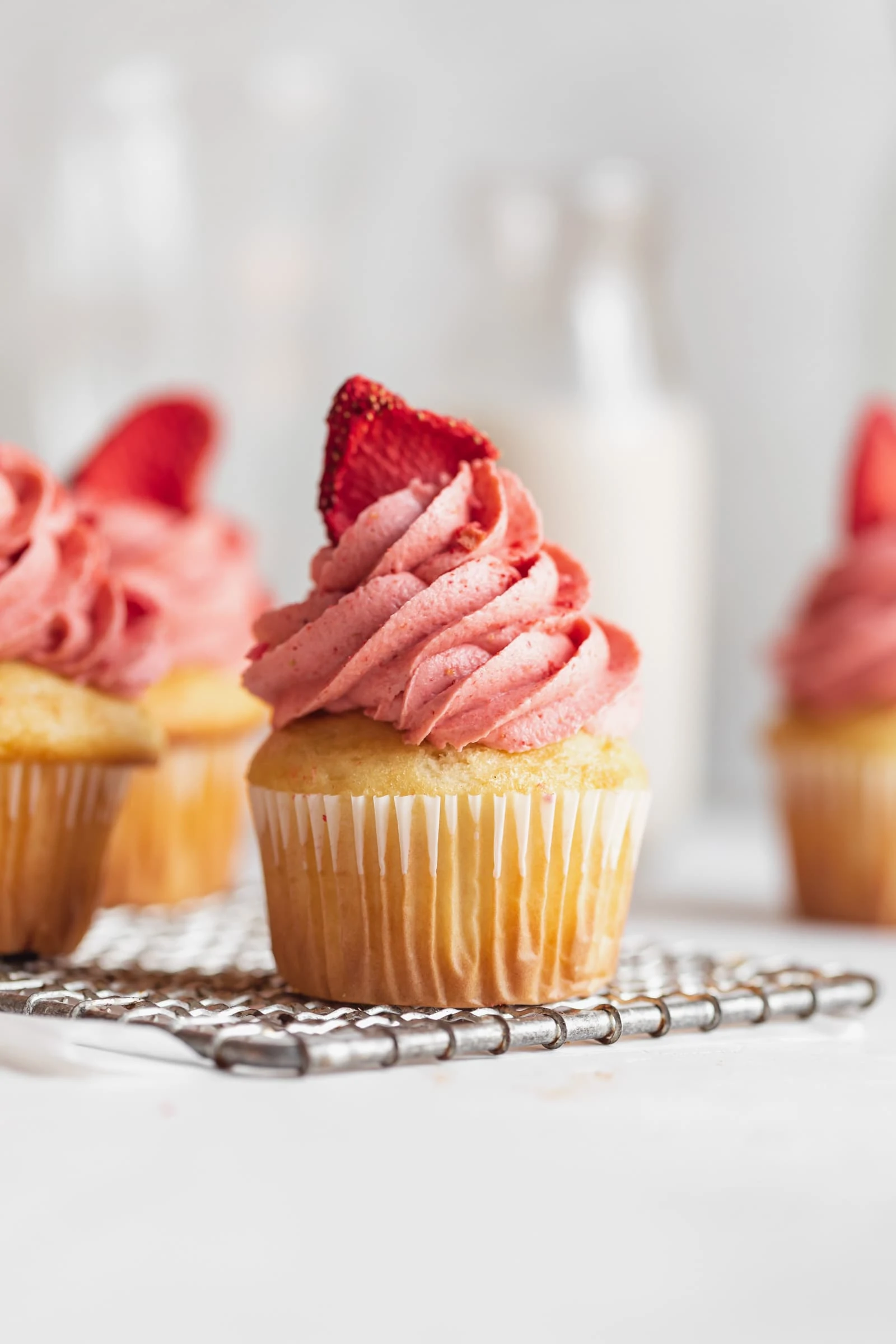 homemade strawberry frosting on a cupcake