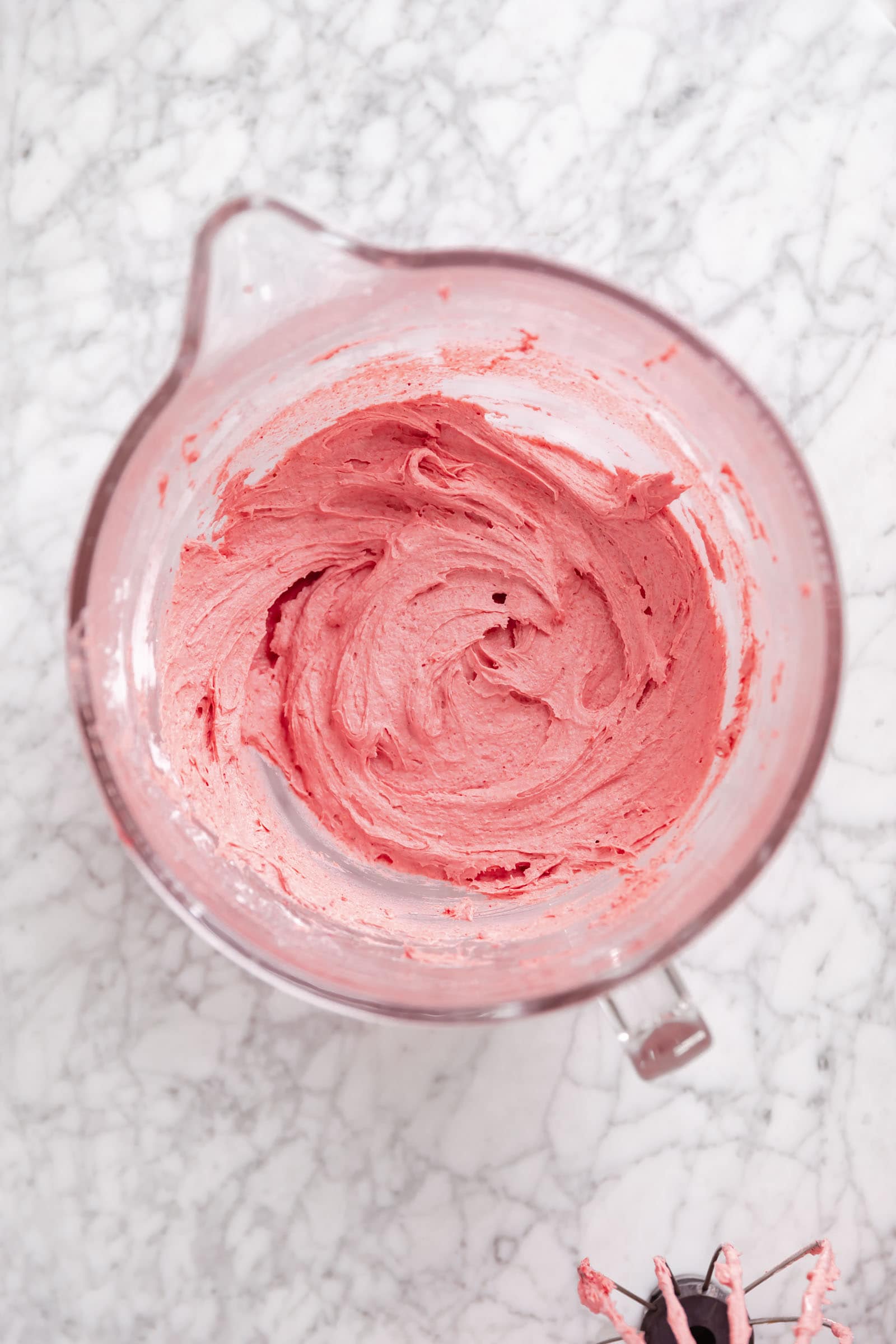 strawberry frosting in a bowl