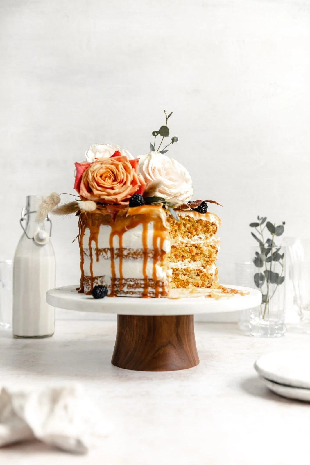 cardamom carrot cake with caramel and flowers