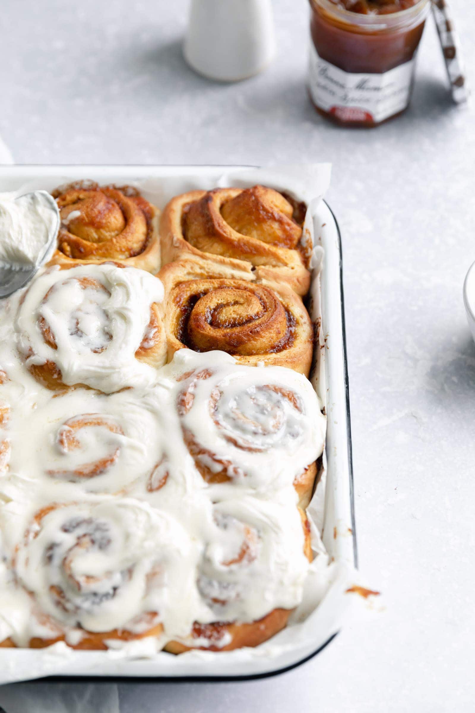 pumpkin spice cinnamon rolls with cream cheese frosting