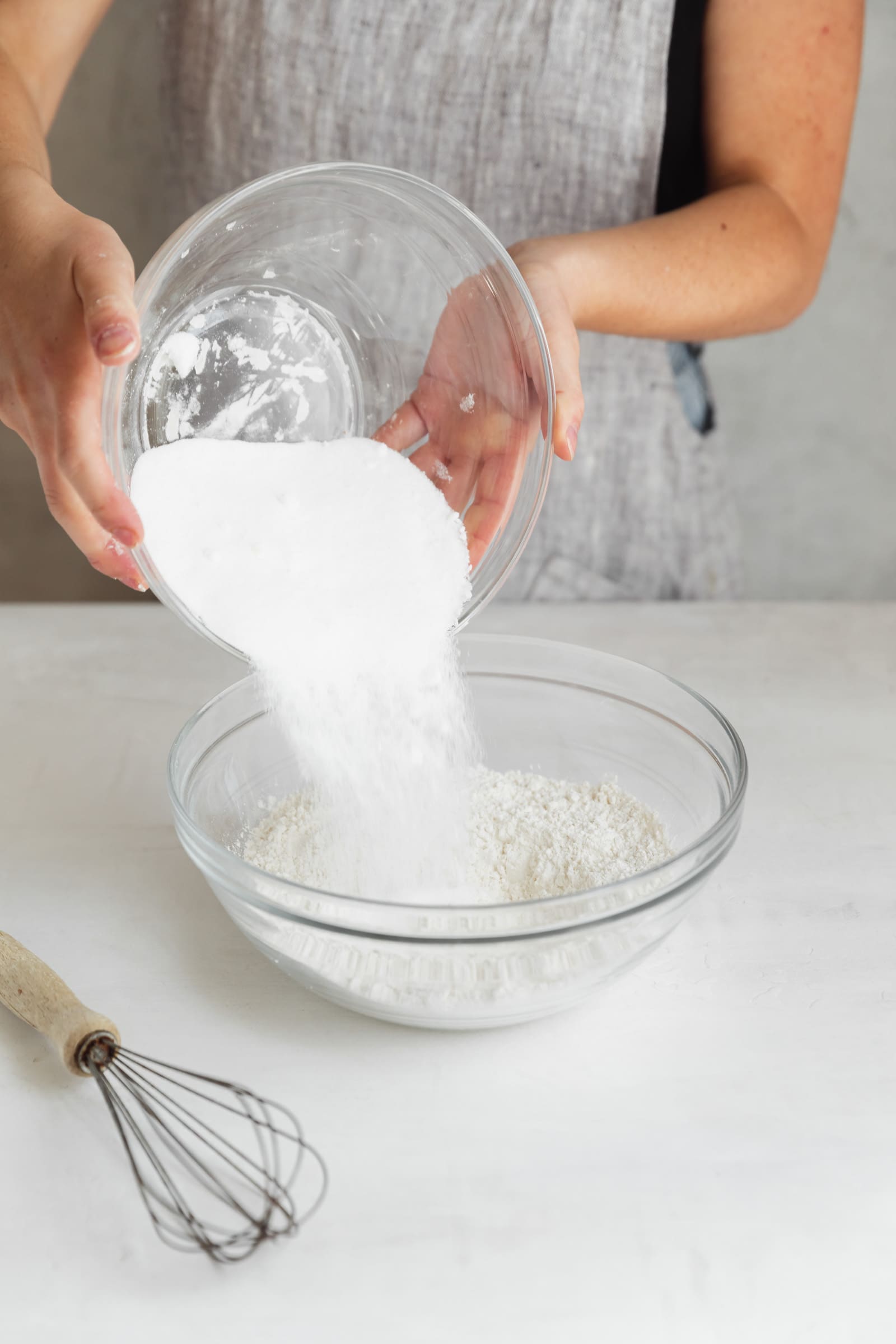 sugar going into a bowl