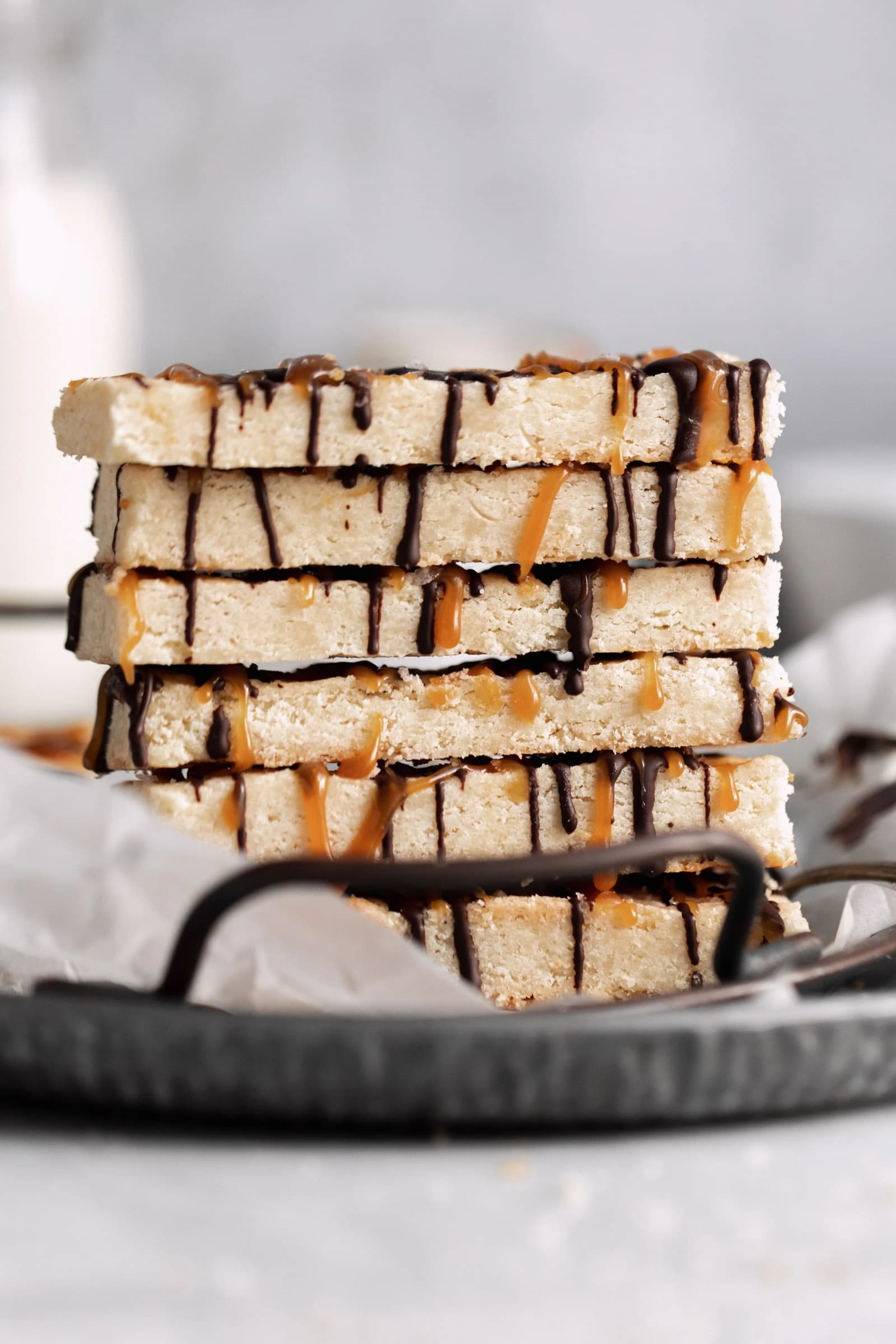 stack of shortbread bars with chocolate and caramel