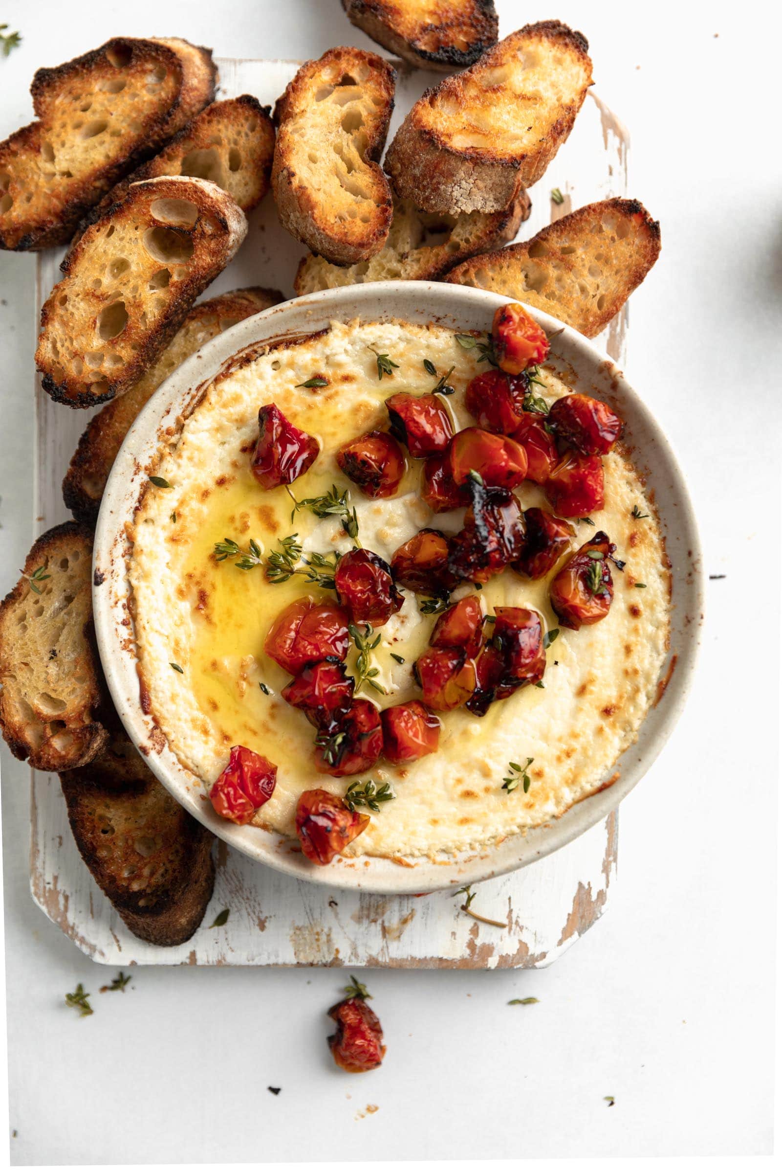 baked goat cheese dip with olive oil and roasted tomatoes