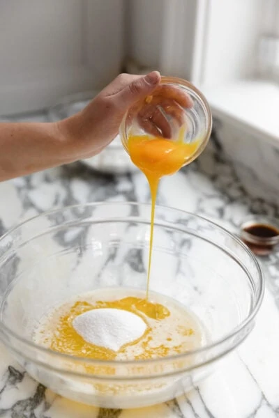 egg yolks going into batter