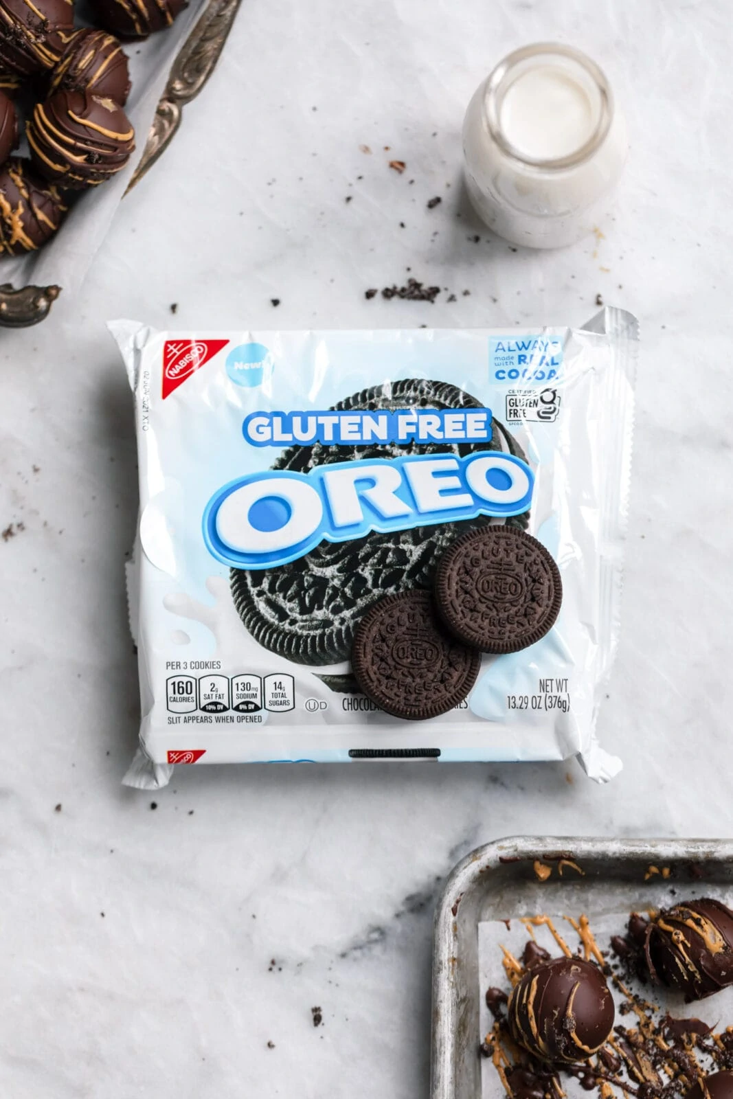gluten free oreo cookies with a glass of milk