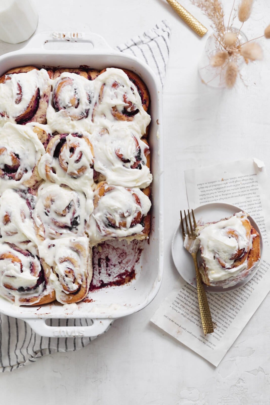 blueberry cinnamon rolls in a white pan