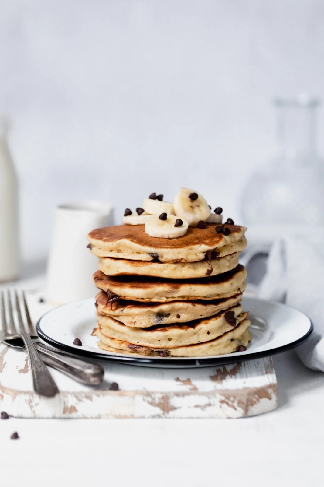 stack of fluffy banana pancakes with chocolate chips