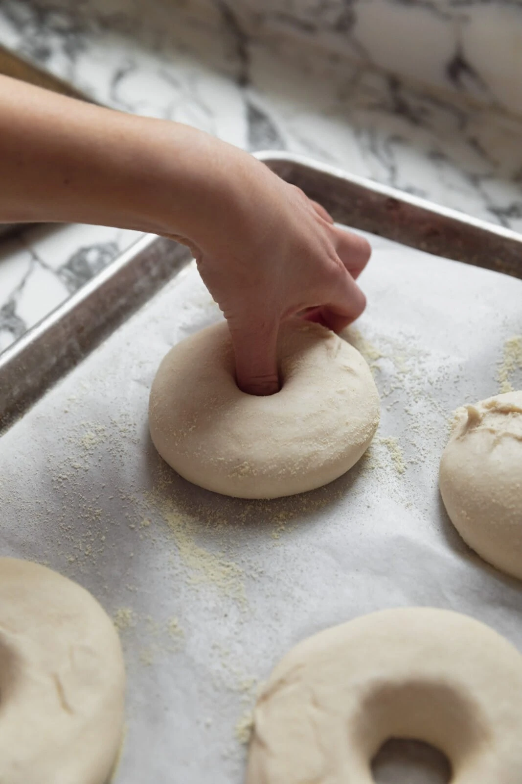 make an indent in the bagel dough balls