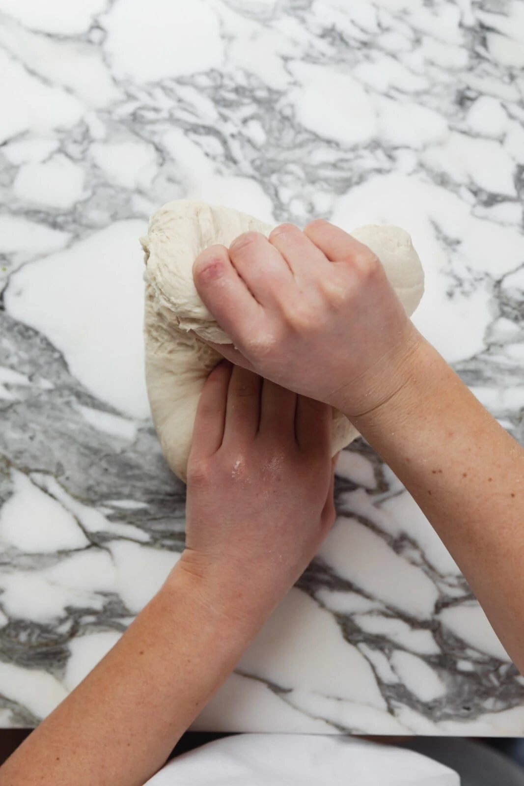 folding bagel dough over itself
