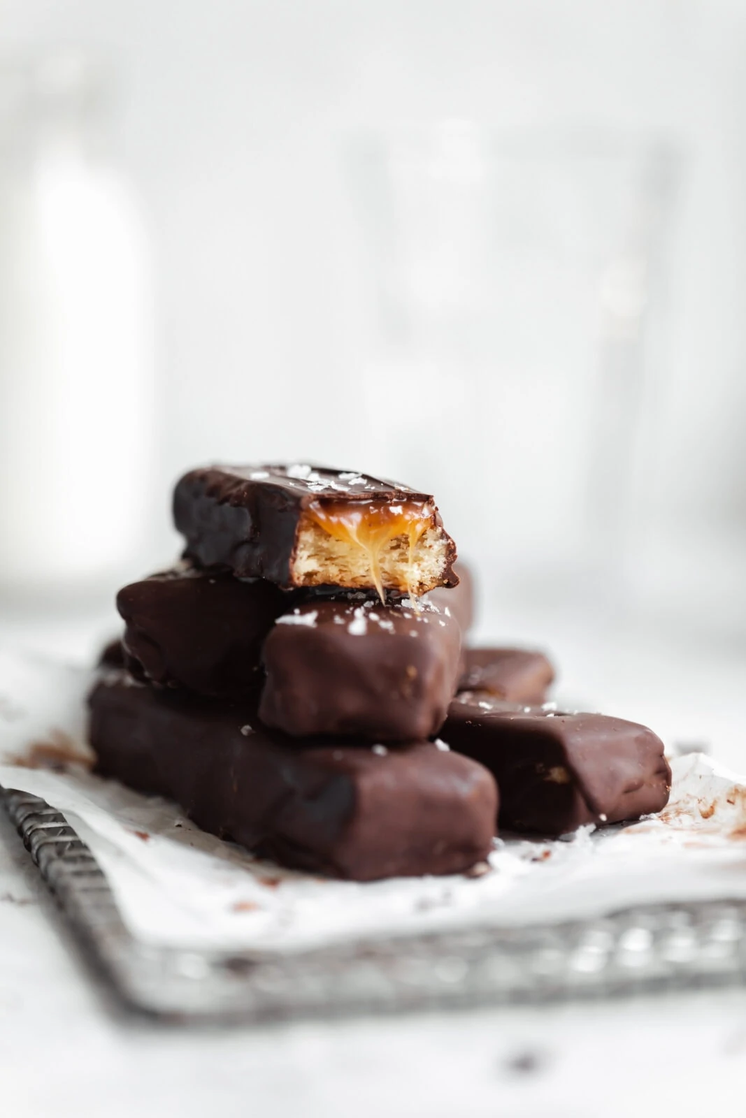 stack of homemade twix bars with caramel drip