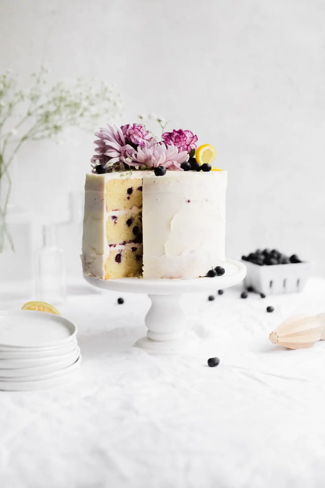 lemon blueberry cake on a cake stand