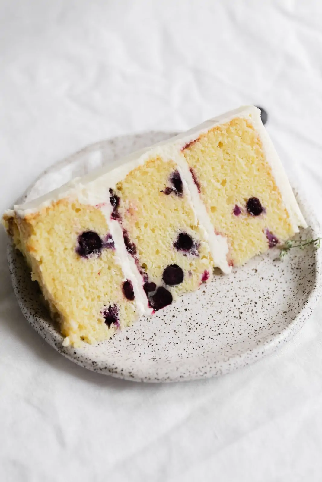 slice of lemon blueberry cake on a plate