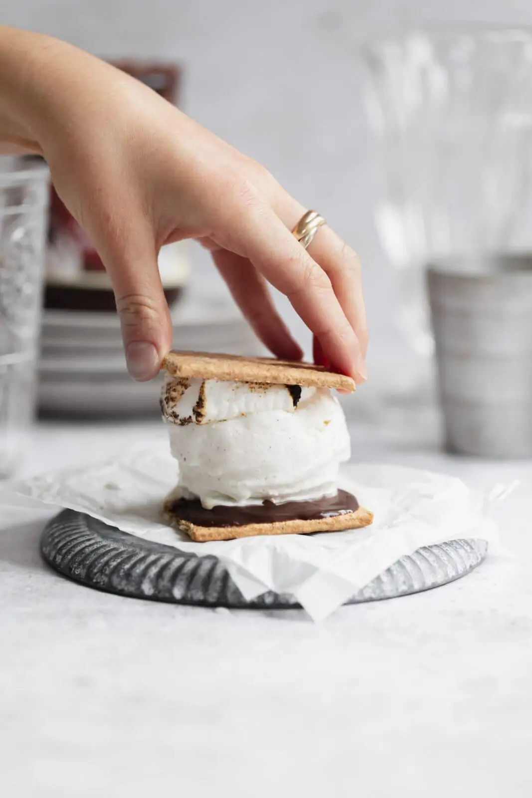 ice cream sandwich with marshmallow, chocolate and graham crackers