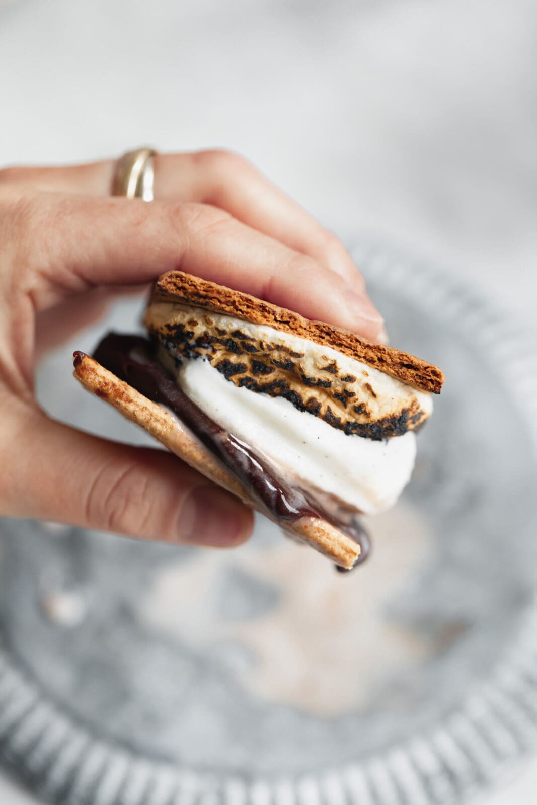 s'mores ice cream sandwich in a hand
