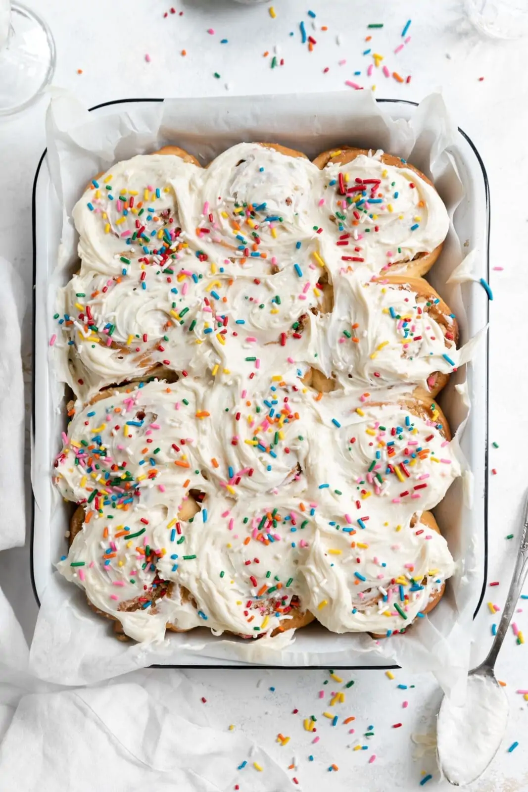 funfetti cinnamon rolls with frosting and sprinkles